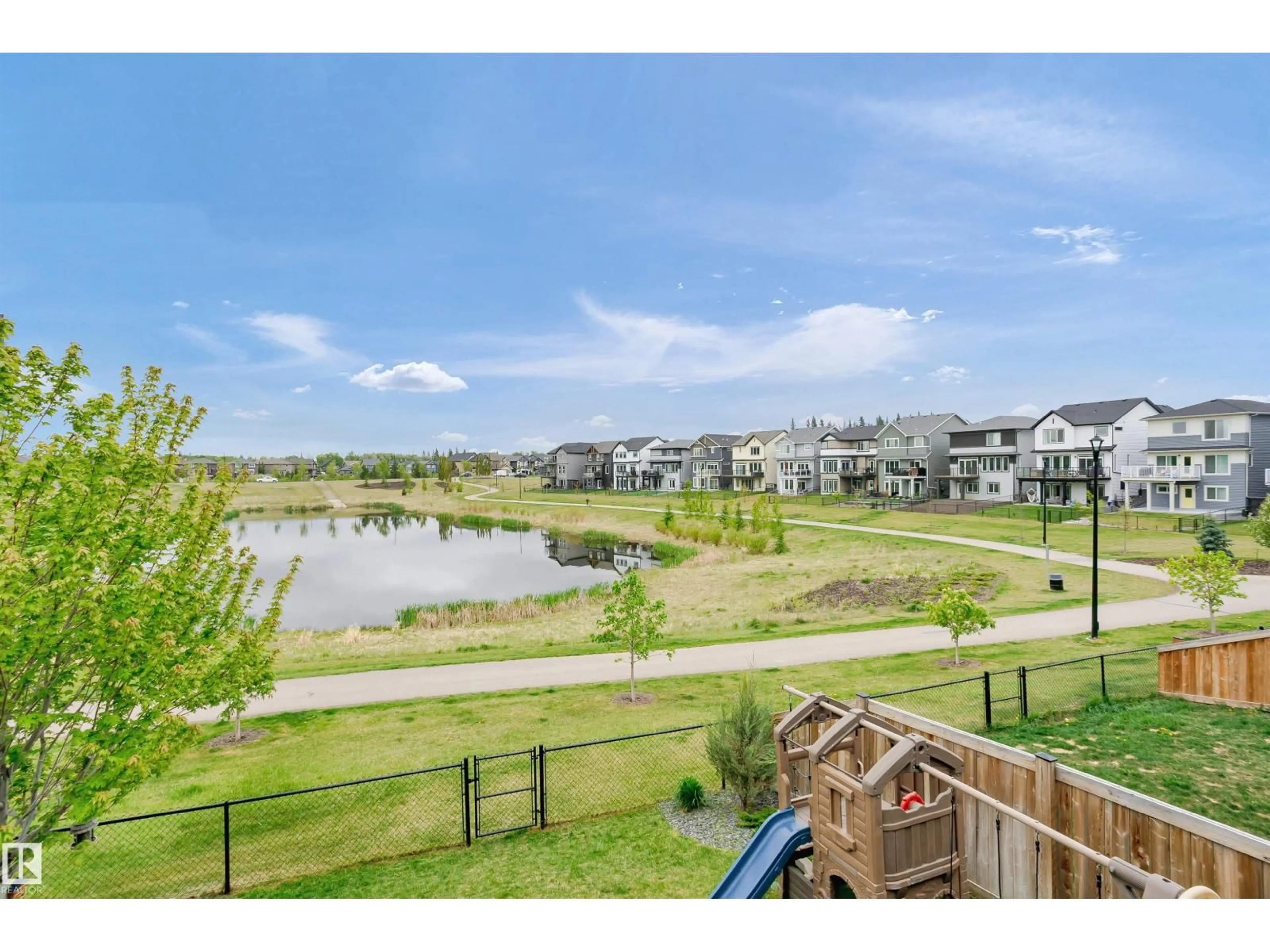 A pic from outside/outdoor area/front of a property/back of a property/a pic from drone, water/lake/river/ocean view for NW - 7721 EIFERT CR, Edmonton Alberta T6M0W2