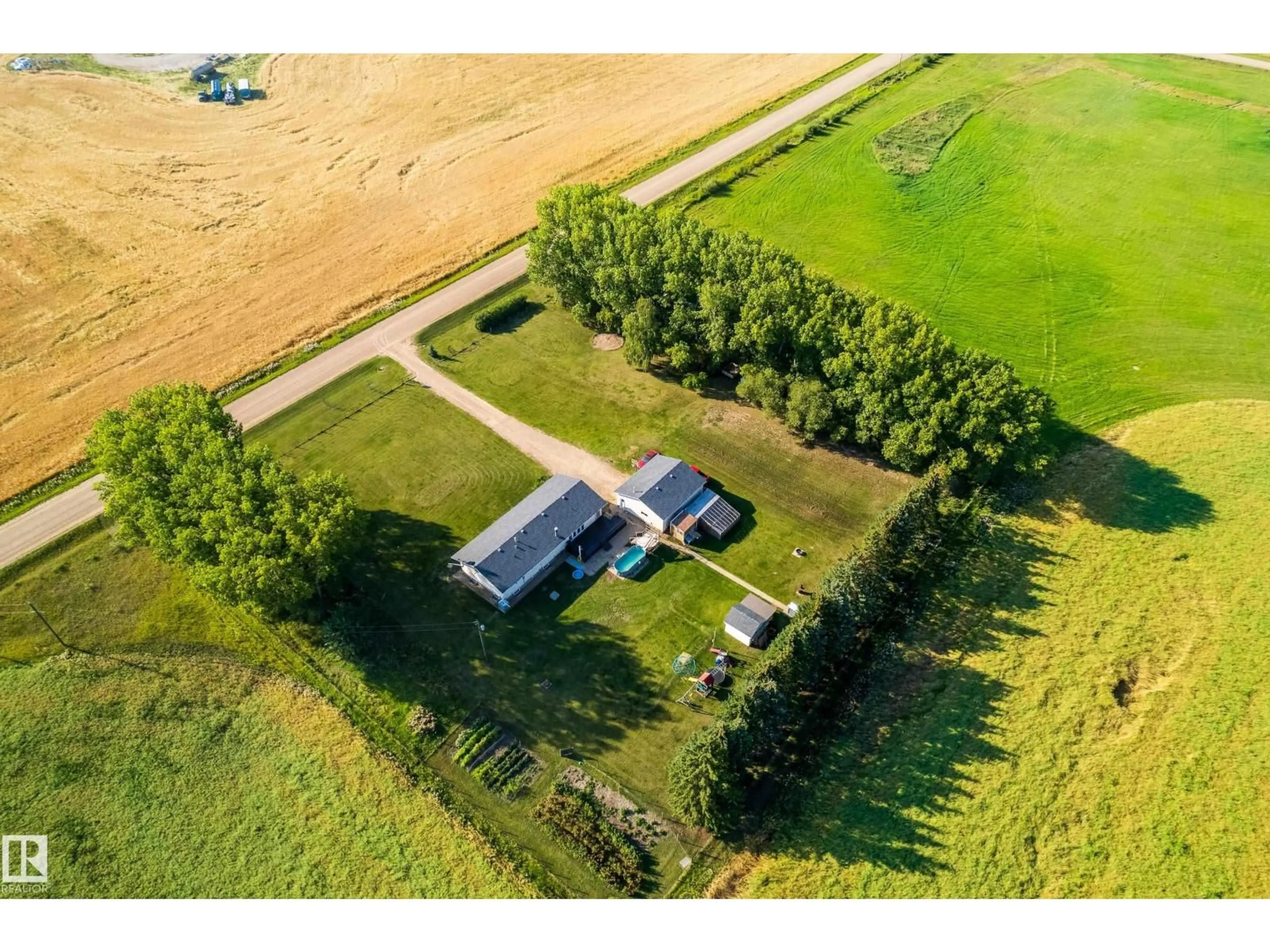 A pic from outside/outdoor area/front of a property/back of a property/a pic from drone, unknown for 57127 RANGE ROAD 251, Rural Sturgeon County Alberta T0G1L1