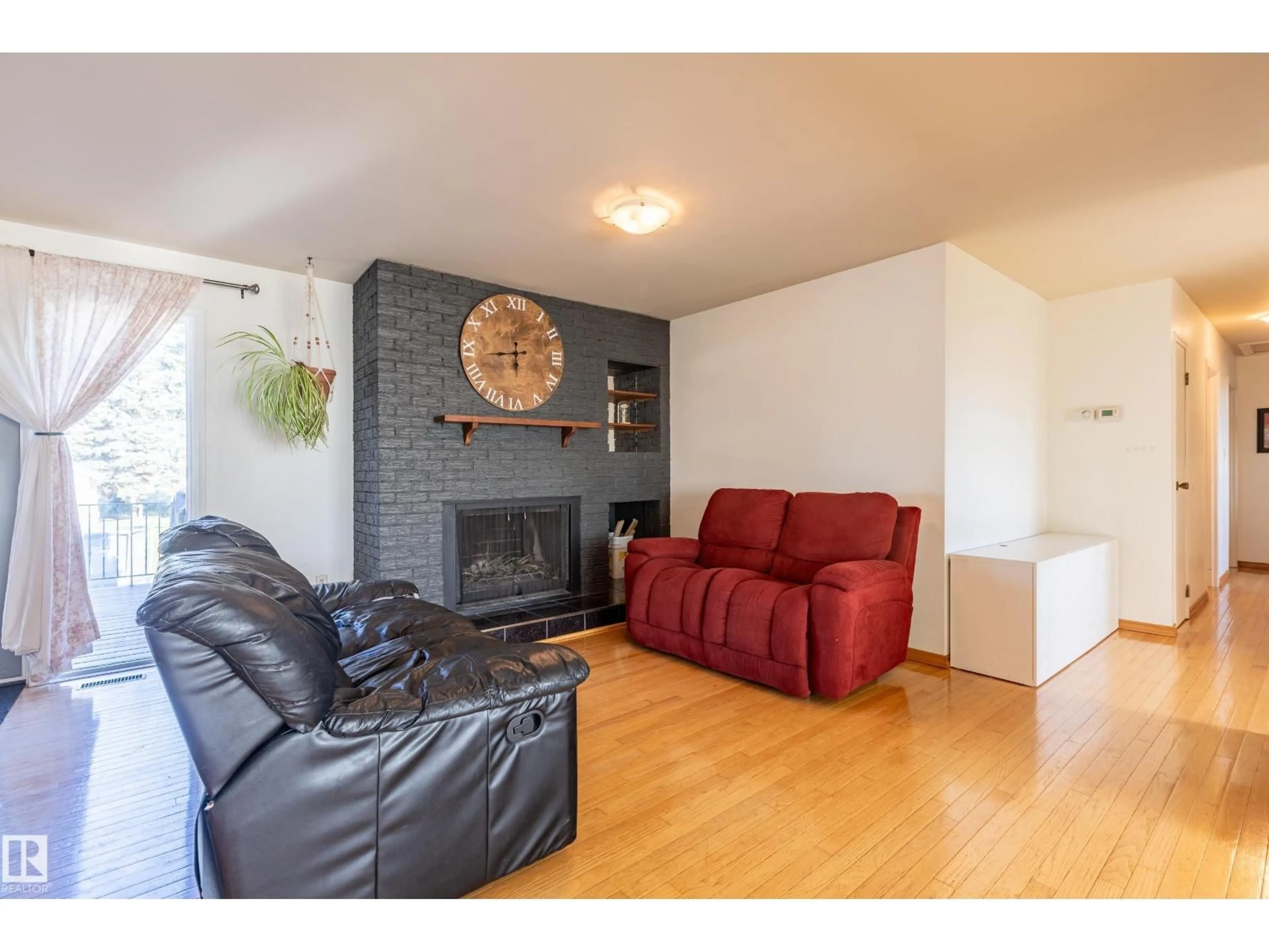 Living room with furniture, wood/laminate floor for 57127 RANGE ROAD 251, Rural Sturgeon County Alberta T0G1L1