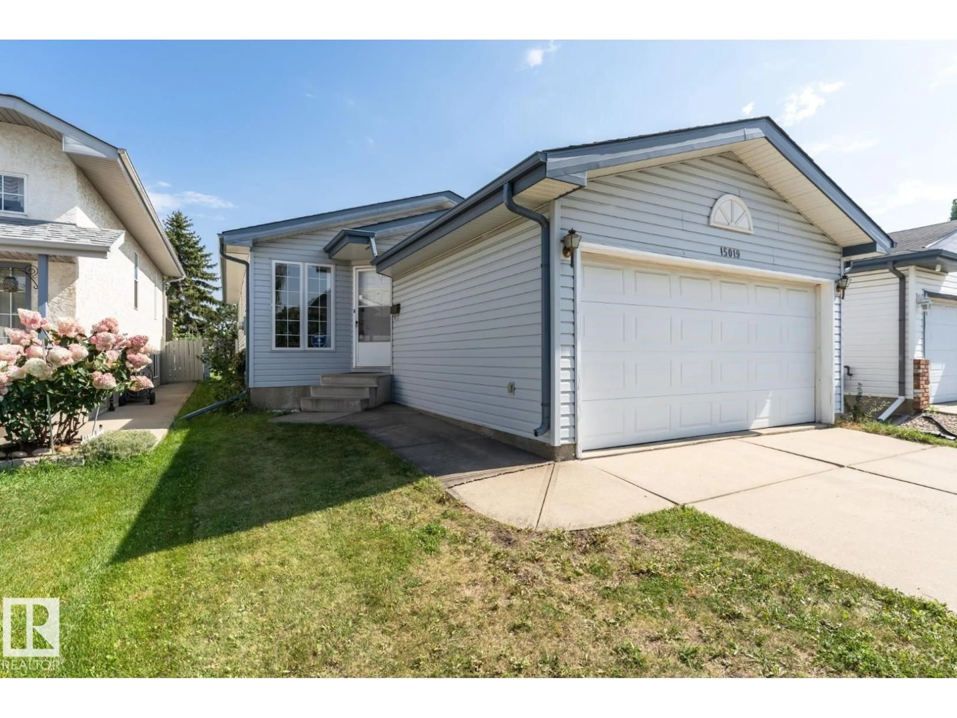 Home with vinyl exterior material, street for 15019 128 ST, Edmonton Alberta T6V1E9