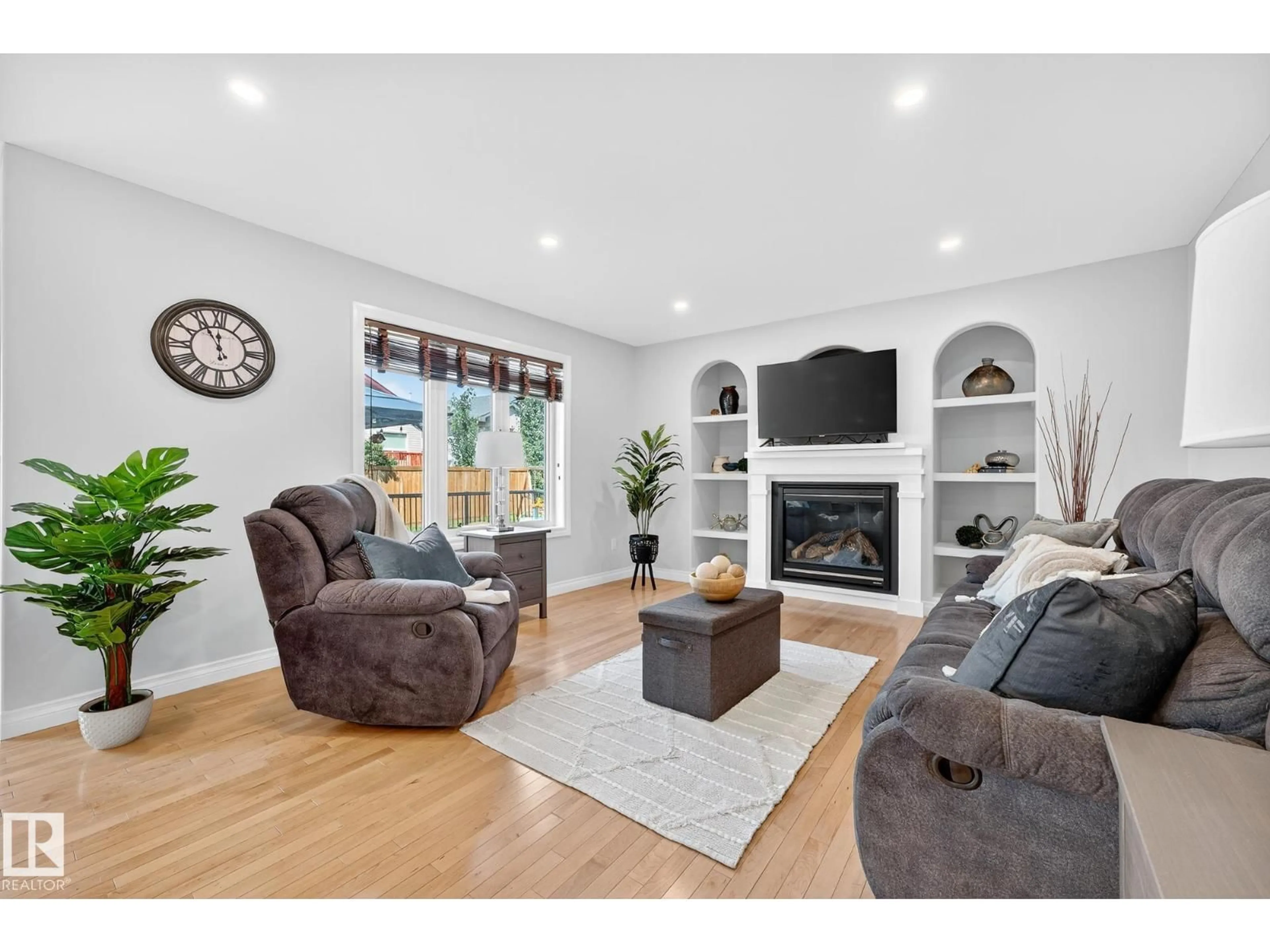 Living room with furniture, wood/laminate floor for 64 WILLOWBY CL, Stony Plain Alberta T7Z2X5