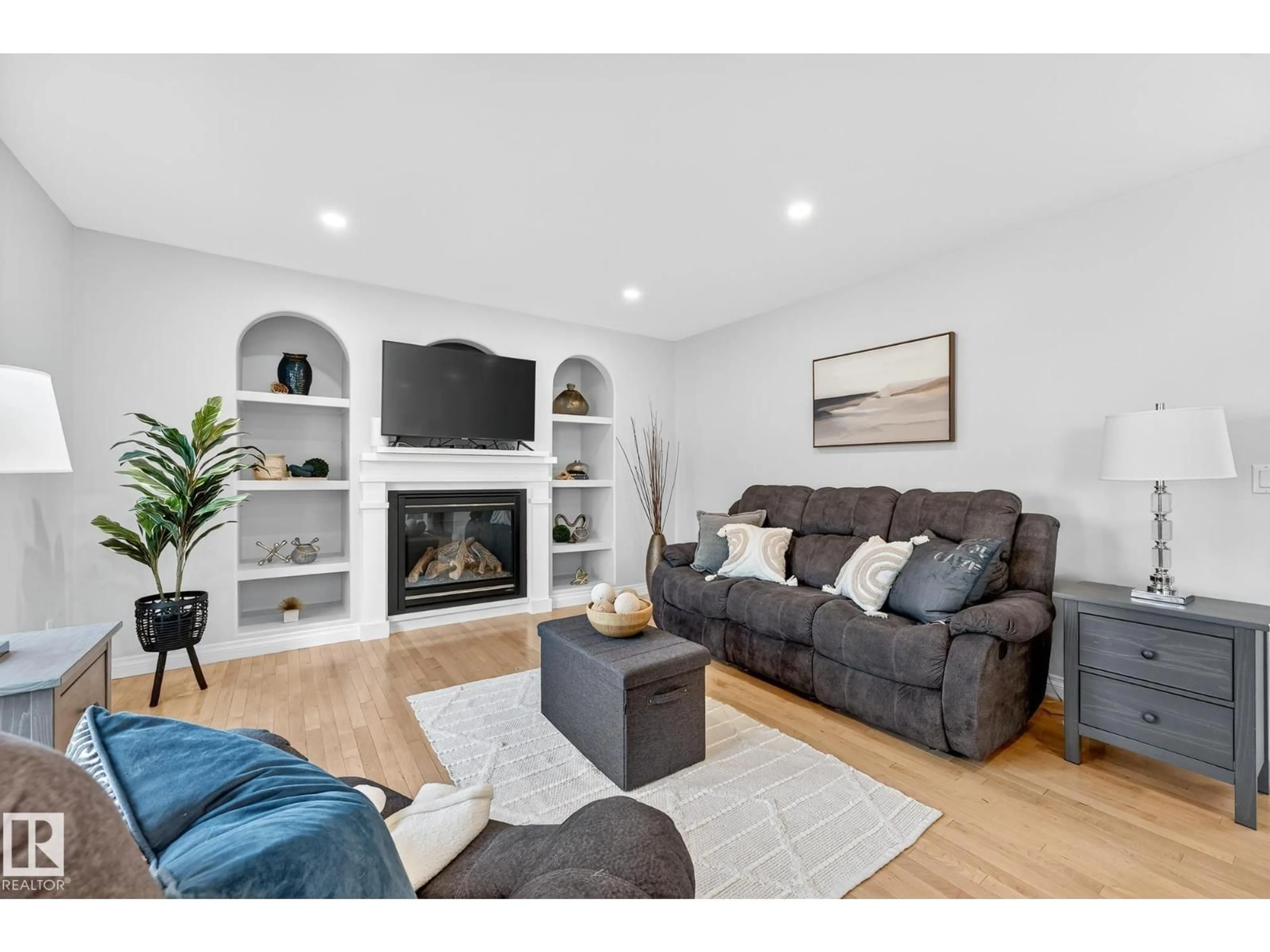 Living room with furniture, wood/laminate floor for 64 WILLOWBY CL, Stony Plain Alberta T7Z2X5