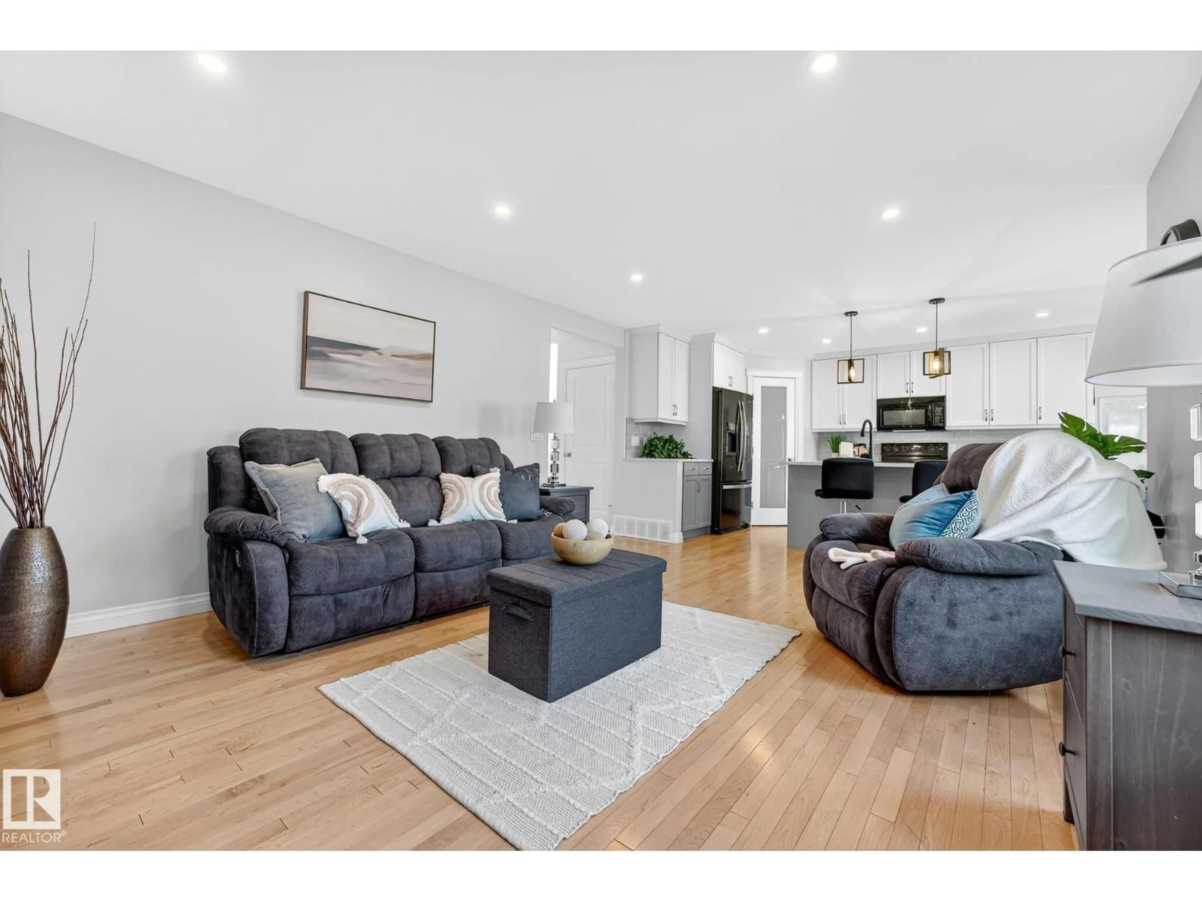 Living room with furniture, wood/laminate floor for 64 WILLOWBY CL, Stony Plain Alberta T7Z2X5