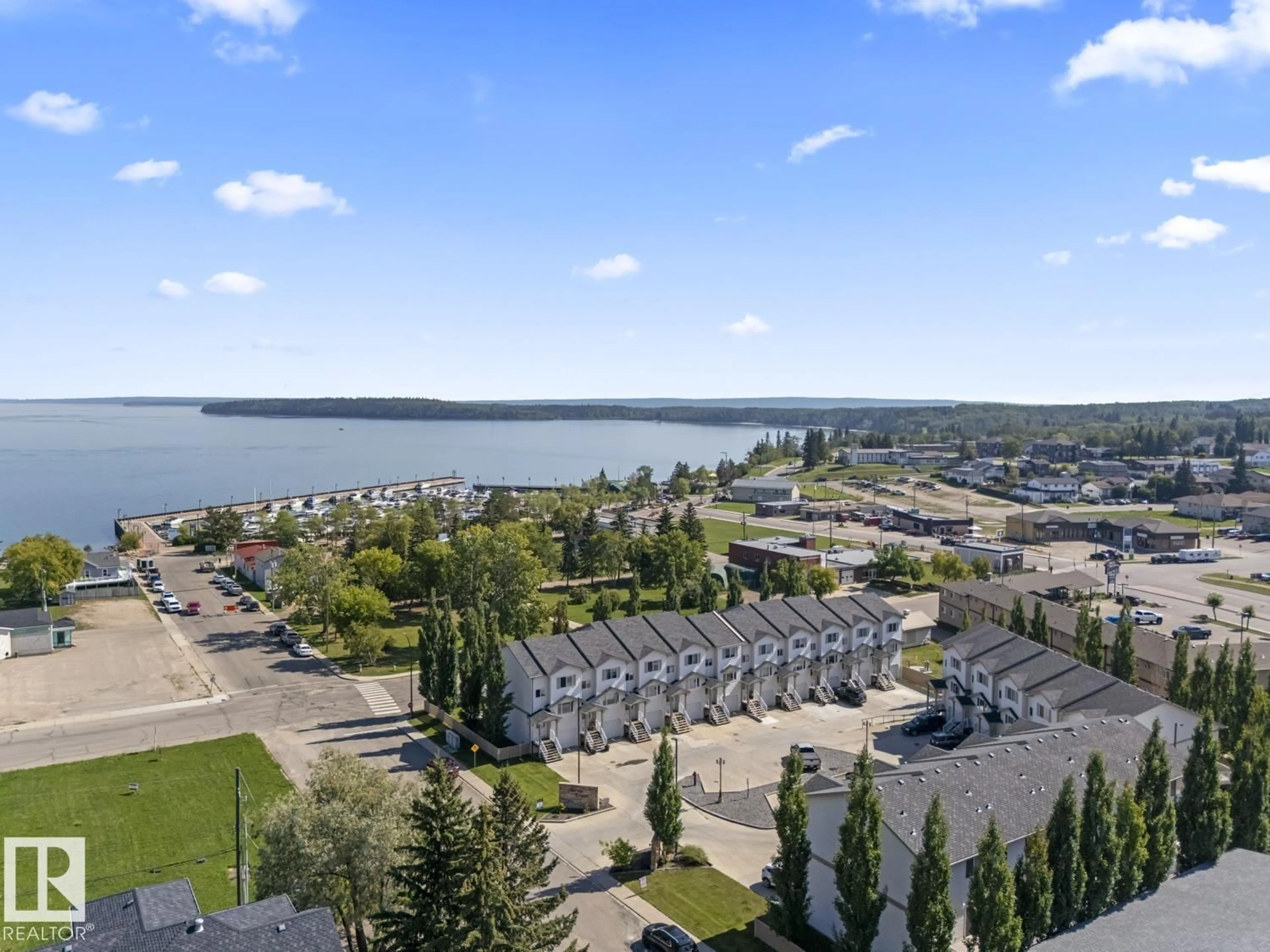 A pic from outside/outdoor area/front of a property/back of a property/a pic from drone, water/lake/river/ocean view for 16 1001 7 AV, Cold Lake Alberta T9M0C4