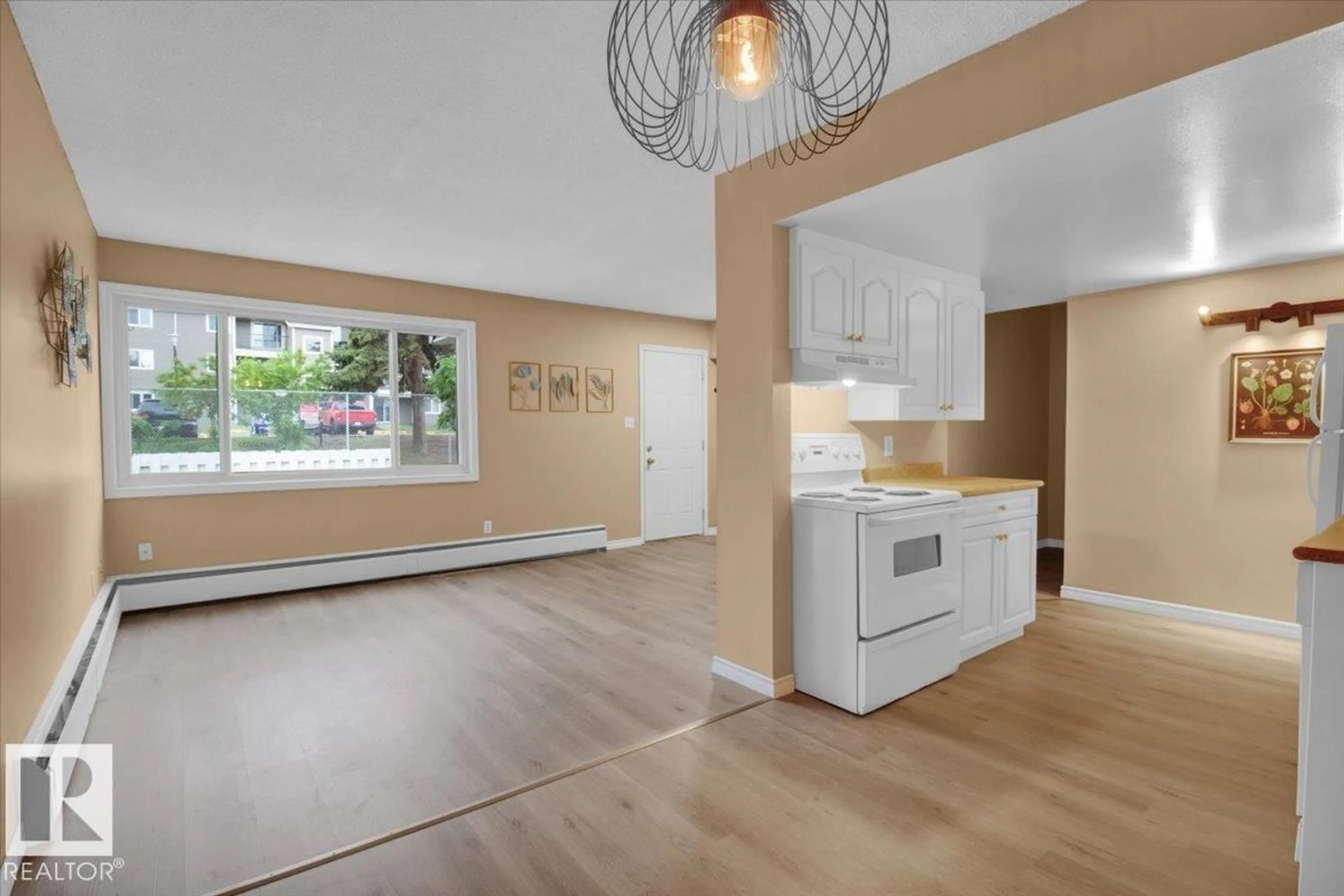 Open concept kitchen, wood/laminate floor for NW - 500 2908 116A AV, Edmonton Alberta T5W4R7