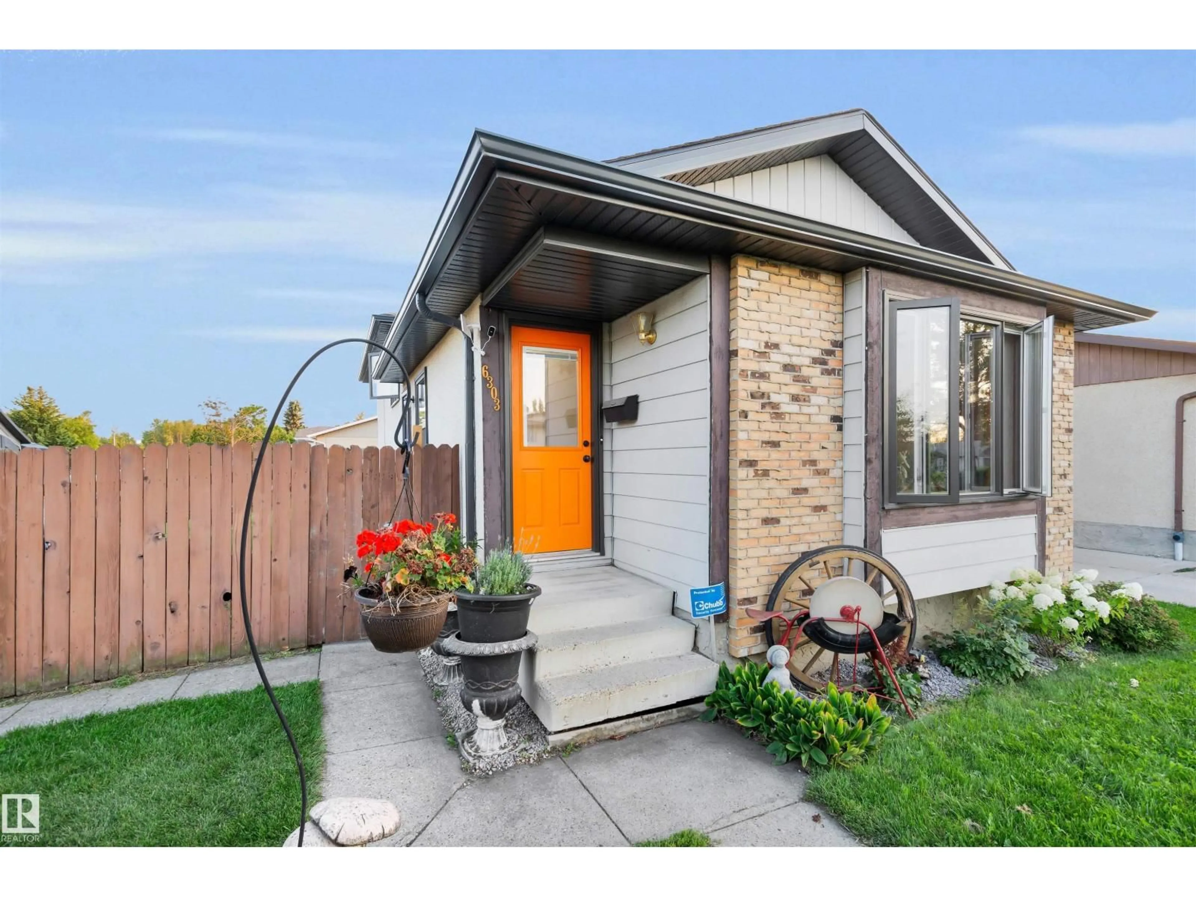 Home with brick exterior material, street for NW - 6303 11 AV, Edmonton Alberta T6L3A8
