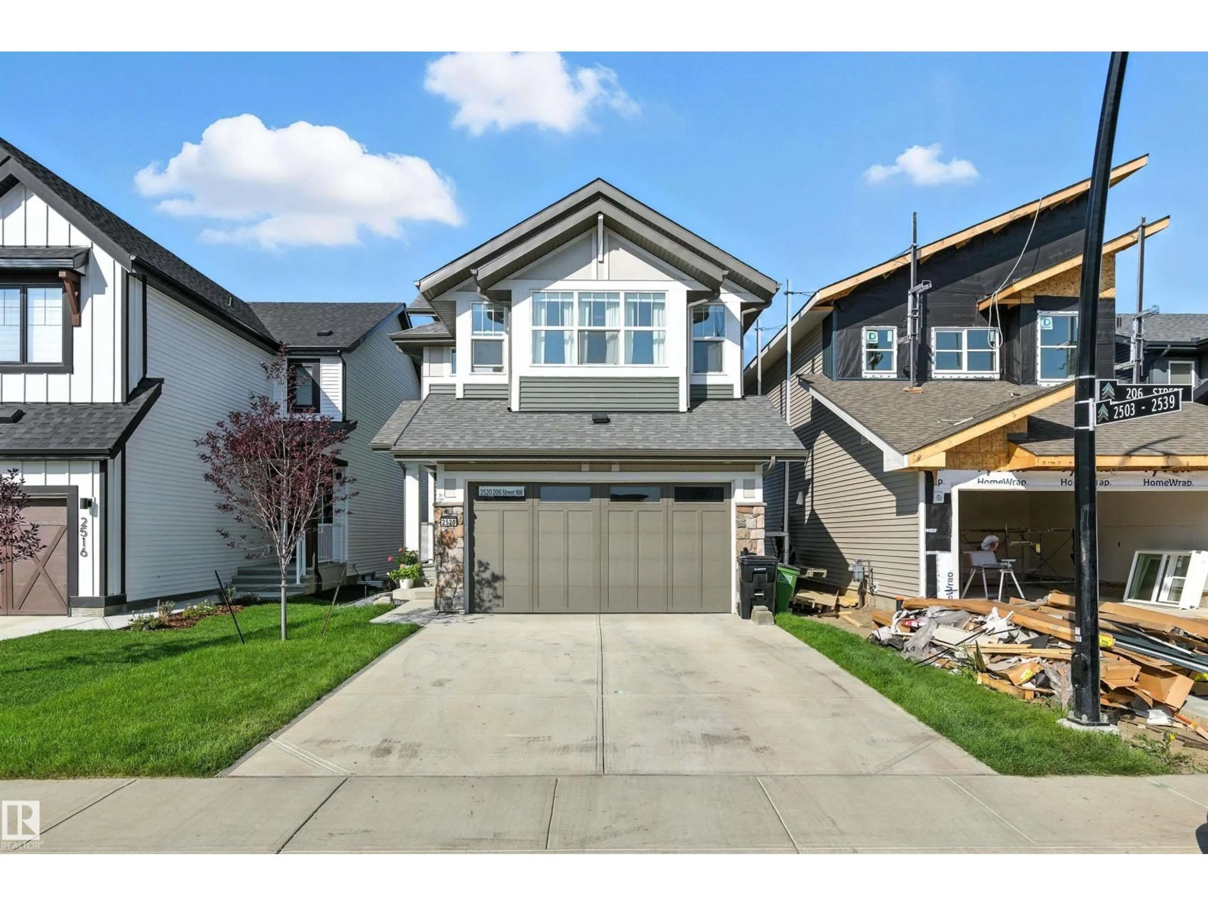 Home with vinyl exterior material, street for 2520 206 STREET NW, Edmonton Alberta T6M1P1