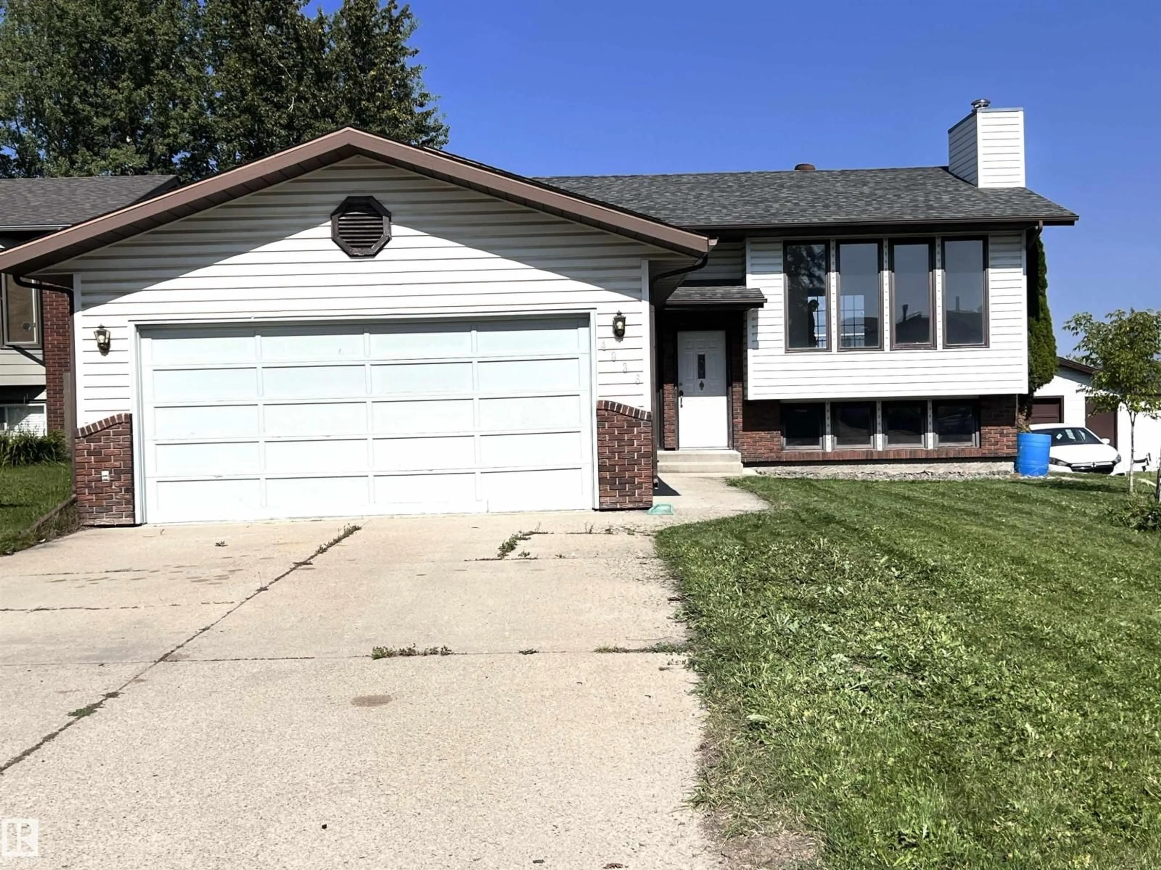 Home with vinyl exterior material, street for 4036 55 AVENUE, Drayton Valley Alberta T7A1B2