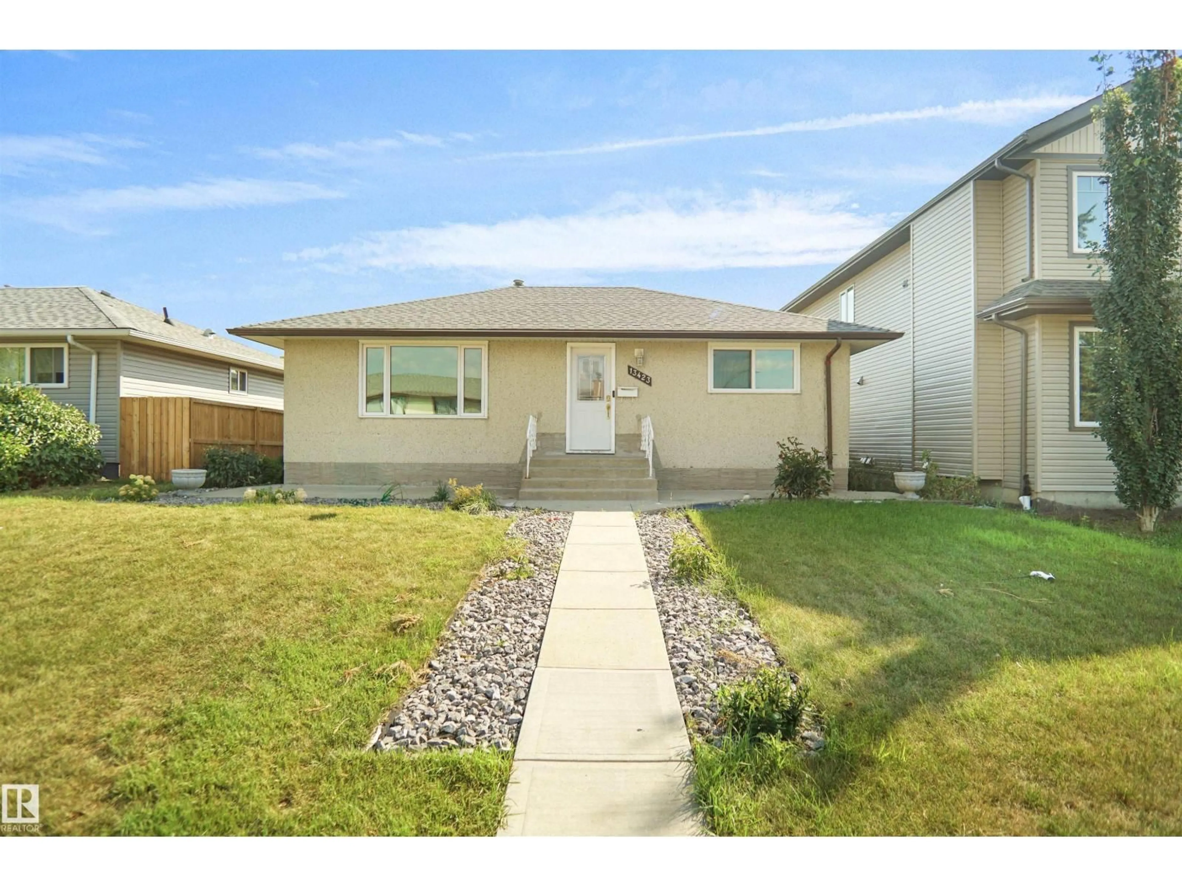 Home with vinyl exterior material, street for 13423 103 ST, Edmonton Alberta T5E4M7