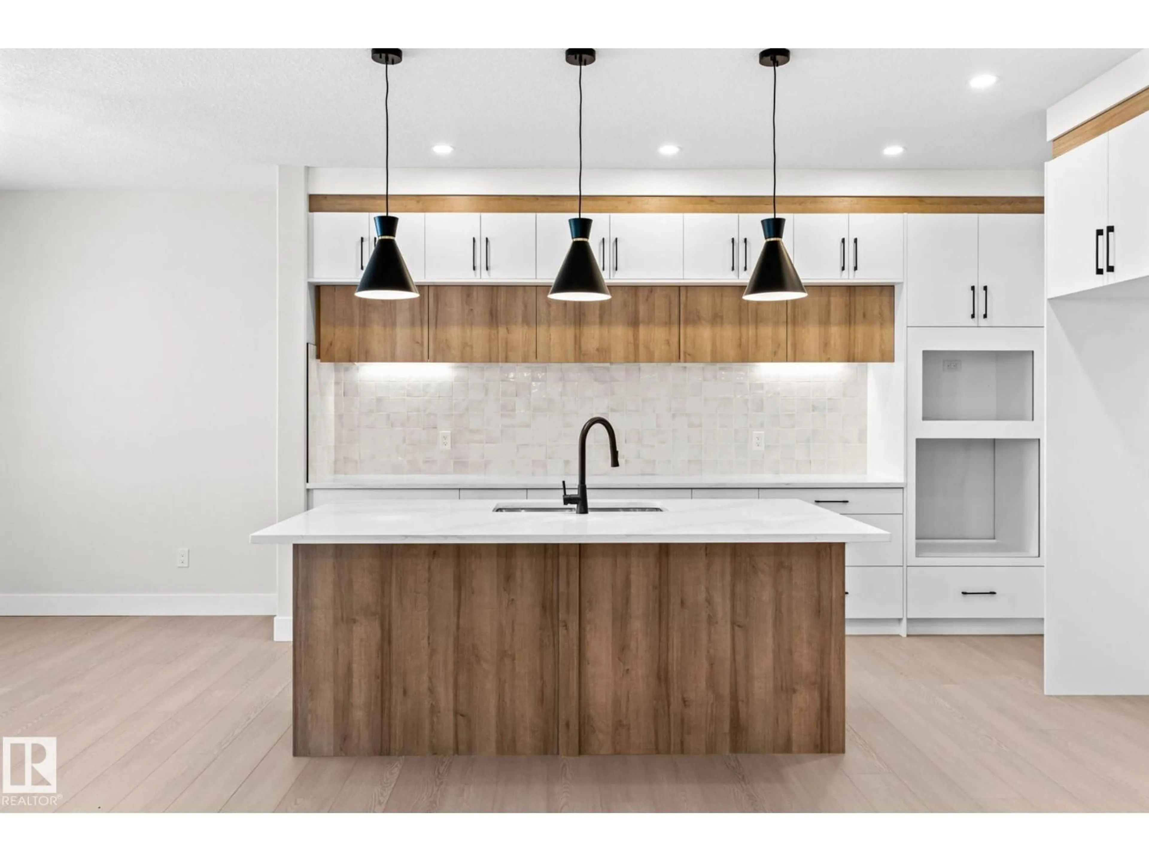 Open concept kitchen, wood/laminate floor for NW - 8512 181 AV, Edmonton Alberta T5Z0X1