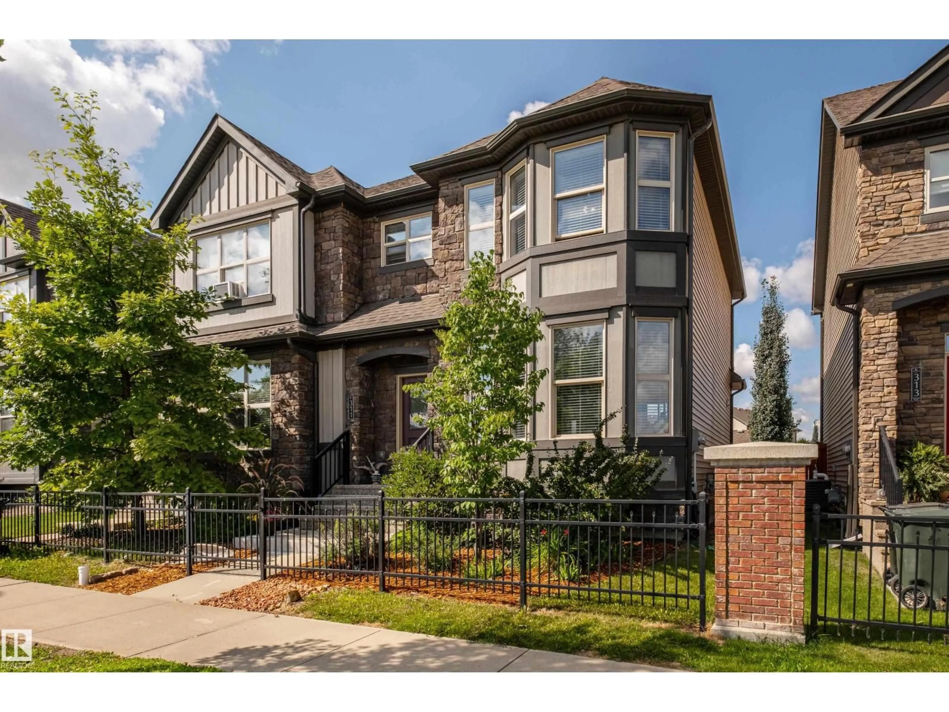 Home with brick exterior material, street for 311 PIONEER RD, Spruce Grove Alberta T7X0T1