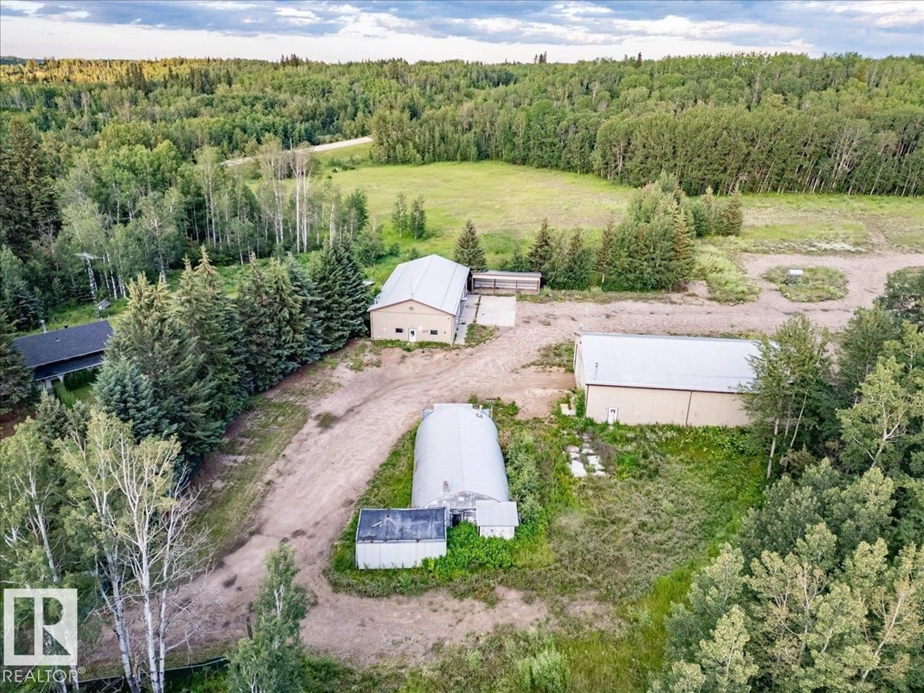 A pic from outside/outdoor area/front of a property/back of a property/a pic from drone, forest/trees view for A - 2047 TWP ROAD 495, Rural Leduc County Alberta T0C2P0