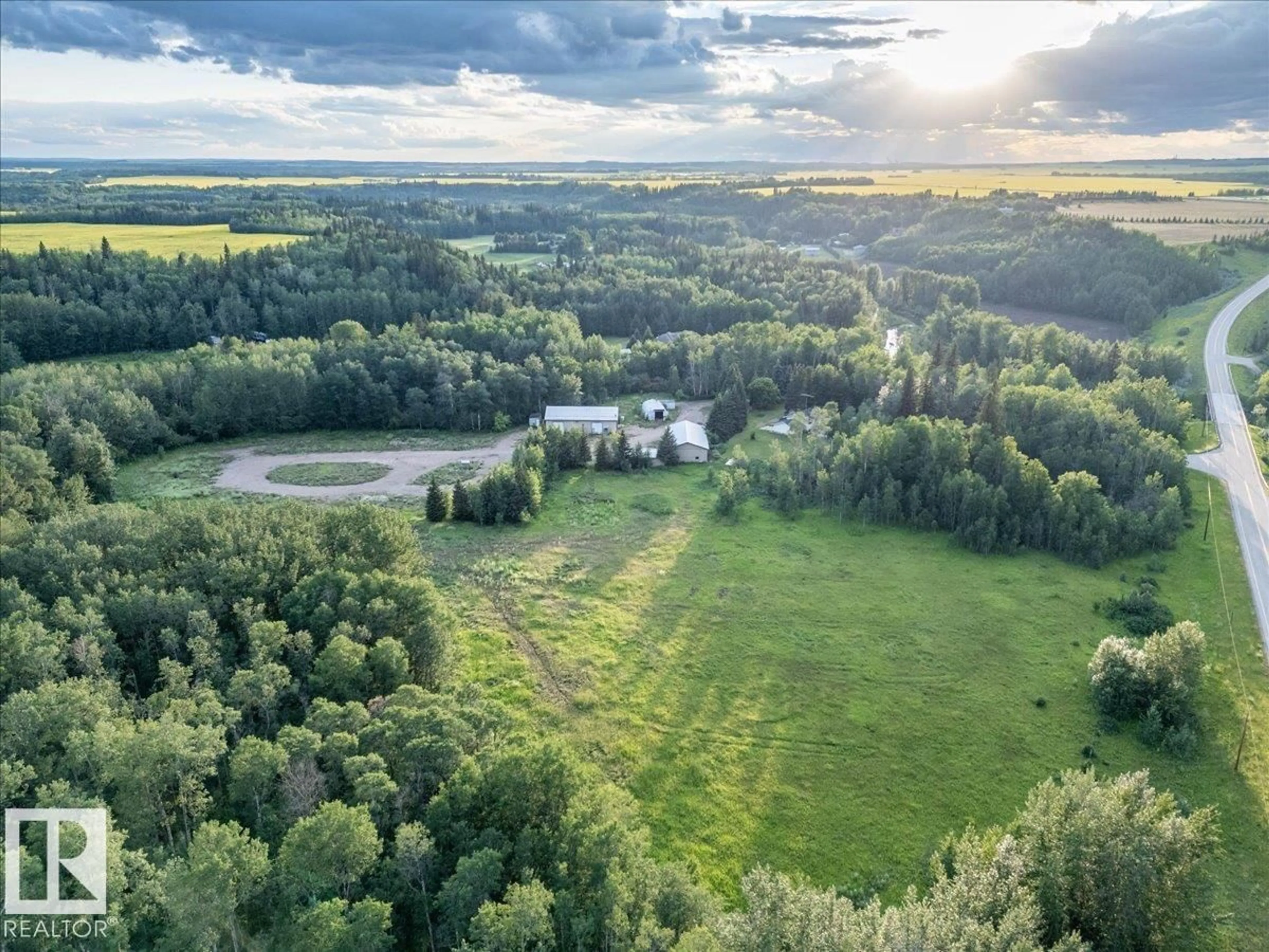 A pic from outside/outdoor area/front of a property/back of a property/a pic from drone, forest/trees view for A - 2047 TWP ROAD 495, Rural Leduc County Alberta T0C2P0
