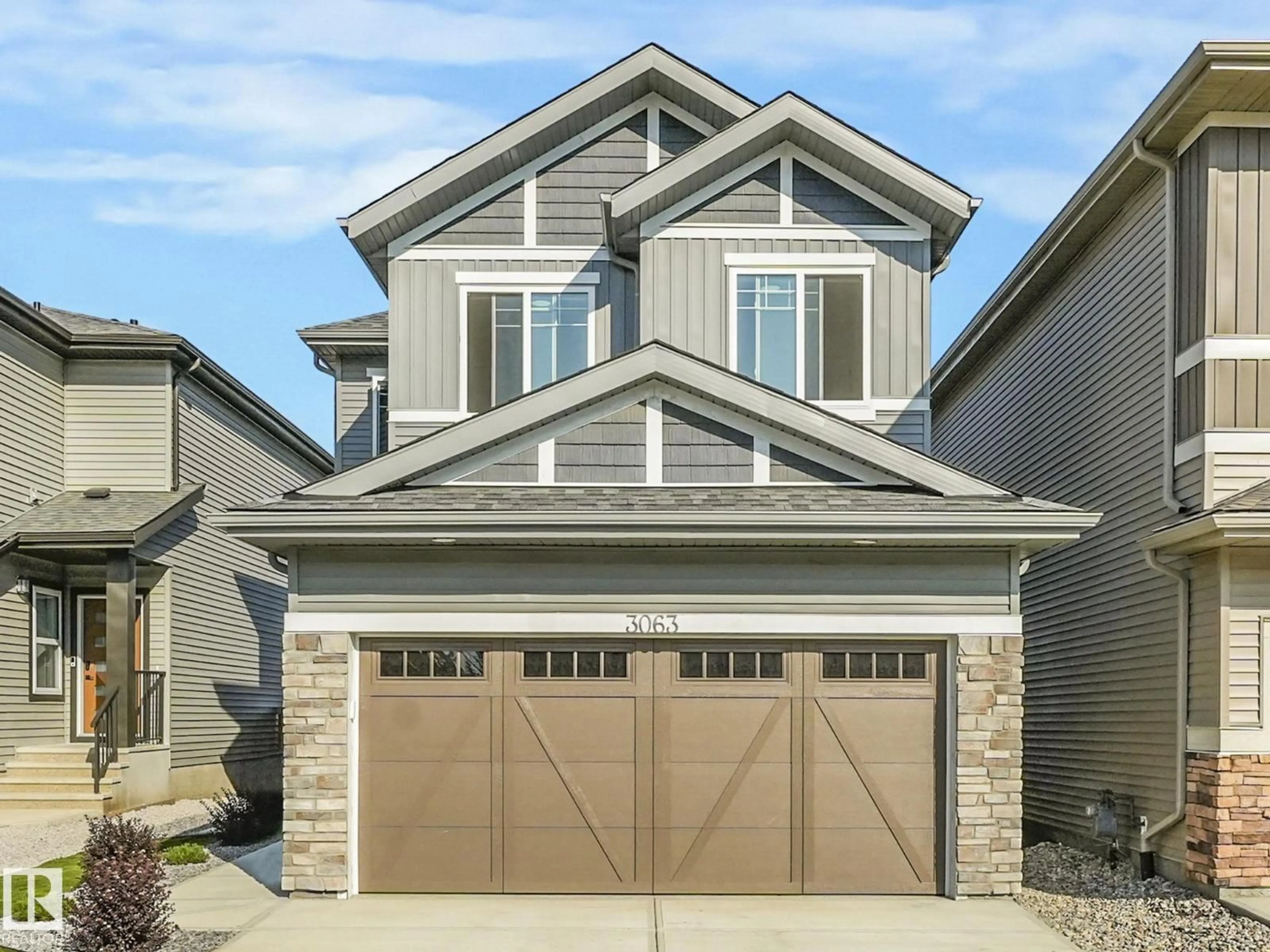 Home with vinyl exterior material, street for NW - 3063 200 ST, Edmonton Alberta T6M1N7