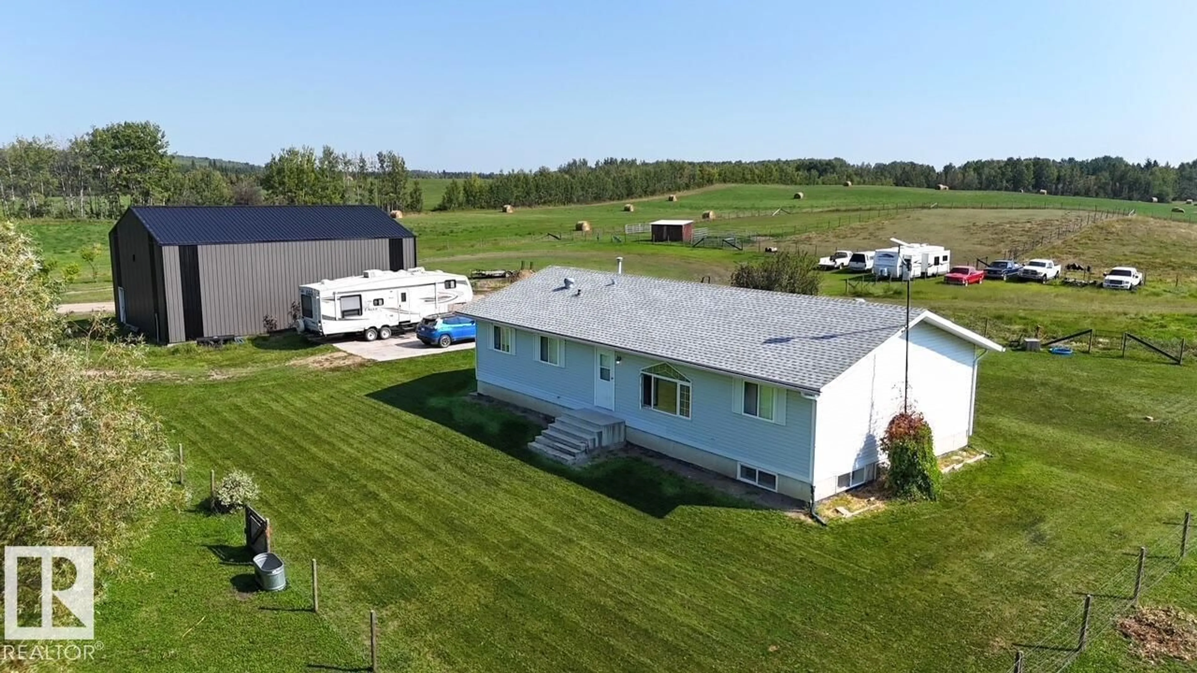 A pic from outside/outdoor area/front of a property/back of a property/a pic from drone, building for 51015 RR 70, Rural Parkland County Alberta T0E2H0