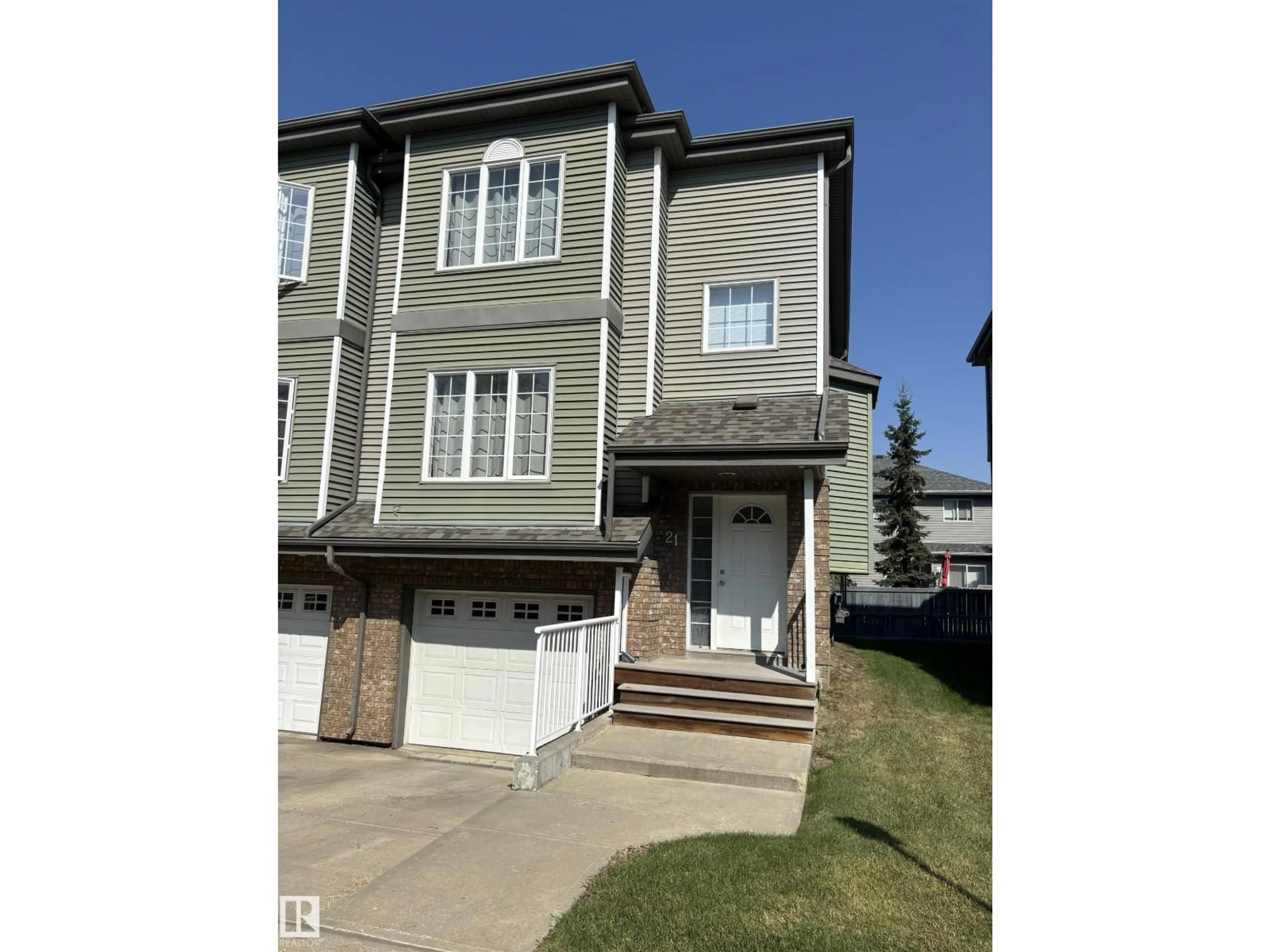 Home with vinyl exterior material, street for 21 - 5102 30 AV, Beaumont Alberta T4X0A9