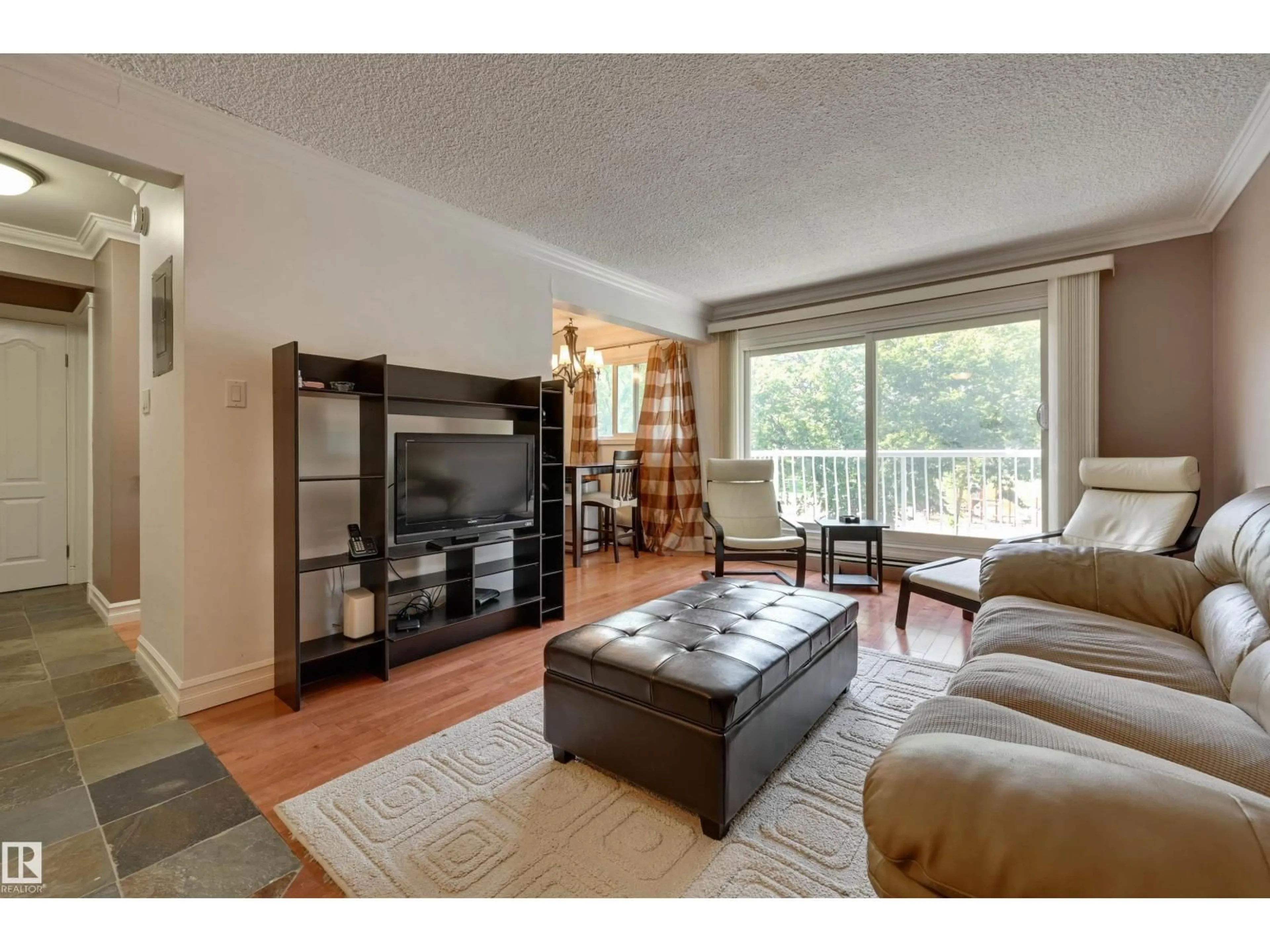 Living room with furniture, wood/laminate floor for #311 - 10225 117 ST, Edmonton Alberta T5X1X7