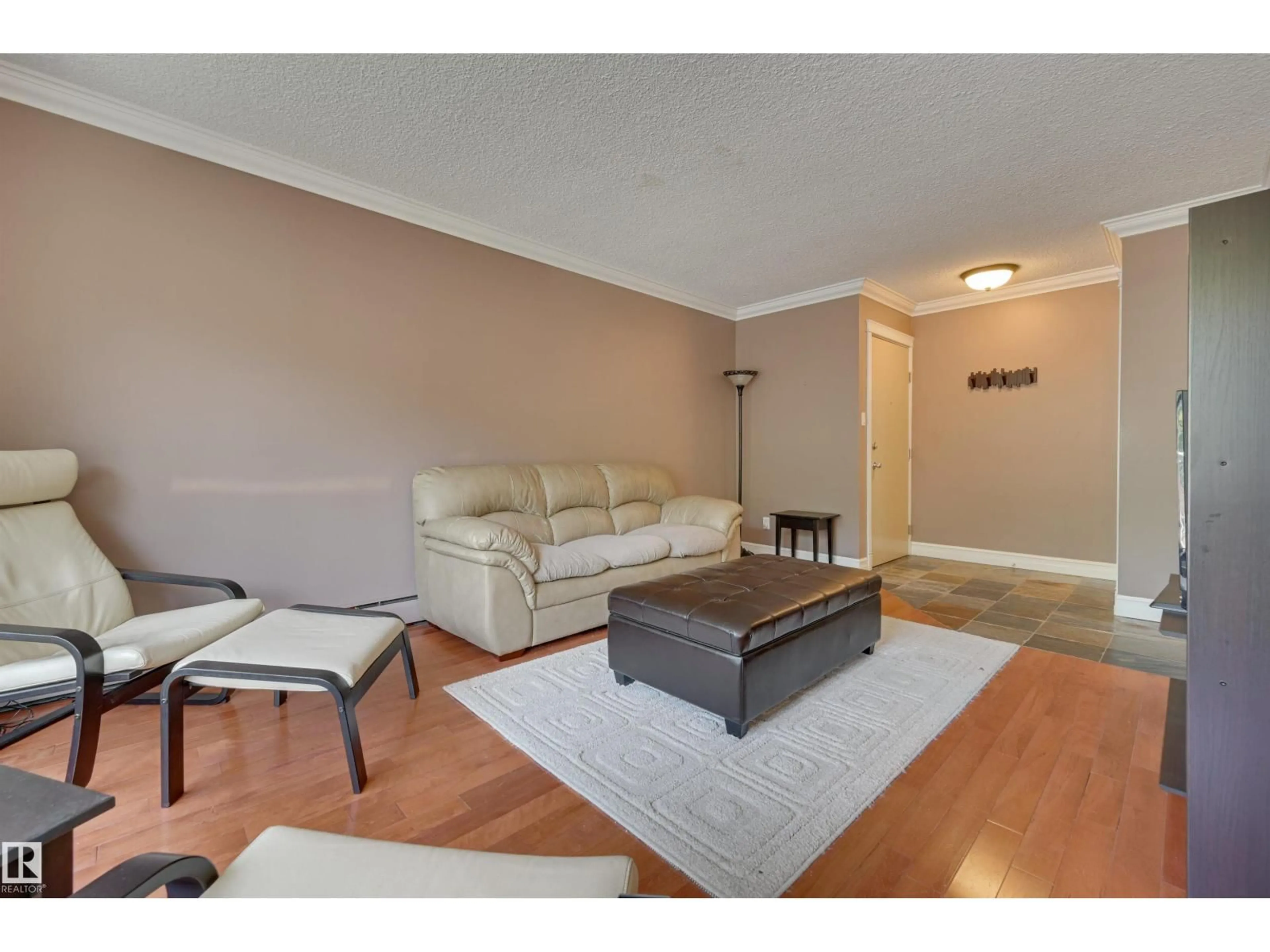 Living room with furniture, wood/laminate floor for #311 - 10225 117 ST, Edmonton Alberta T5X1X7