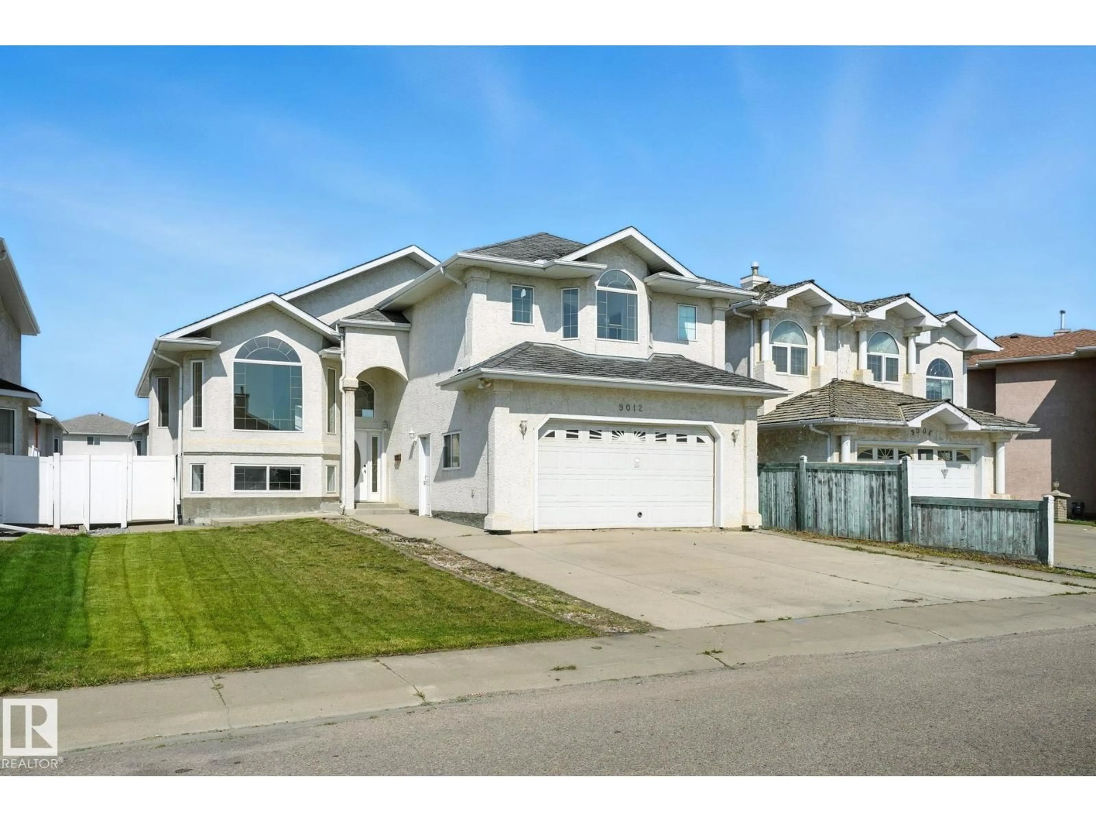 Home with vinyl exterior material, street for 9012 157 AV, Edmonton Alberta T5Z3G2