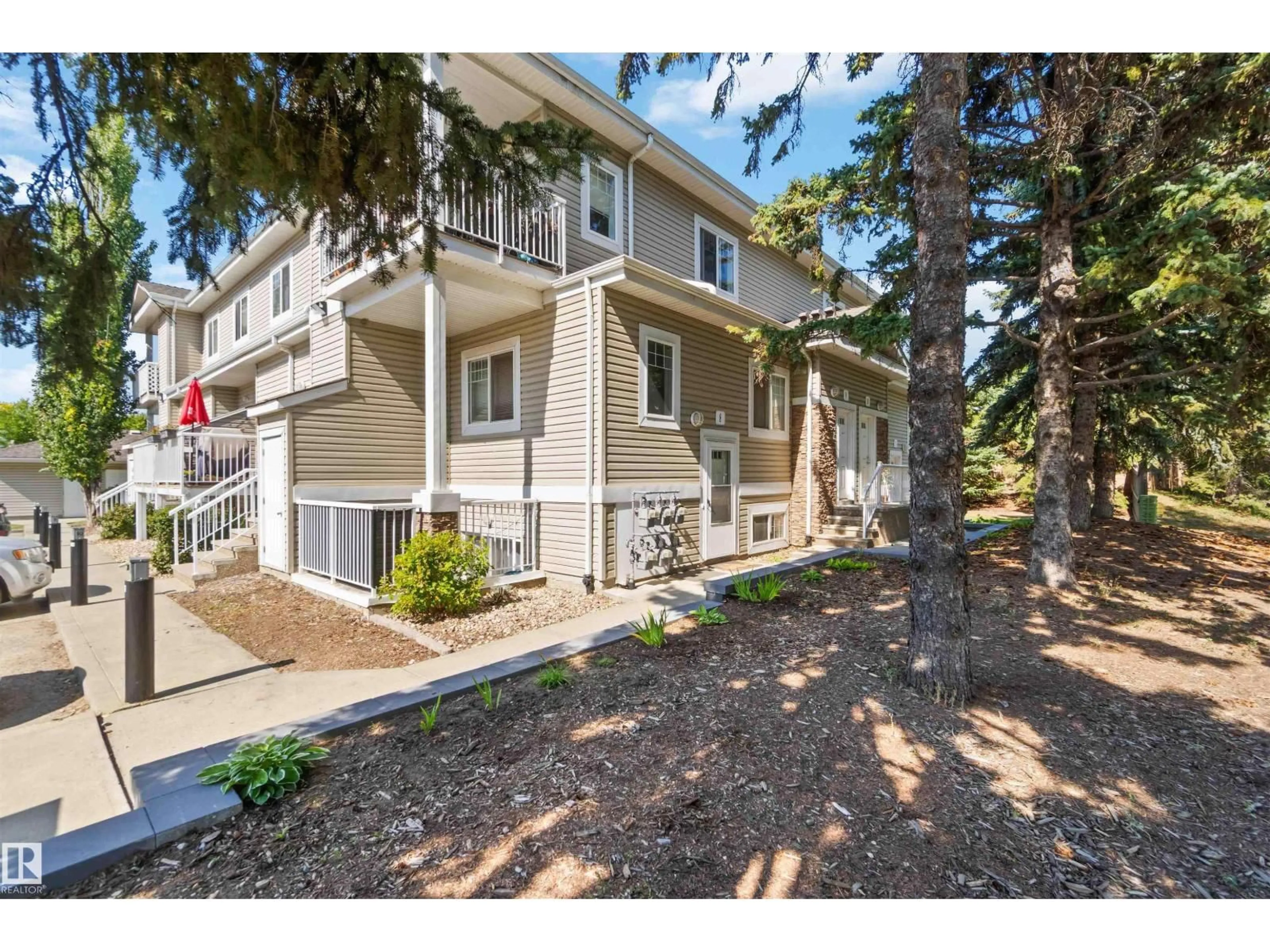 A pic from outside/outdoor area/front of a property/back of a property/a pic from drone, street for 8A - 79 BELLEROSE DR, St. Albert Alberta T8N1C5