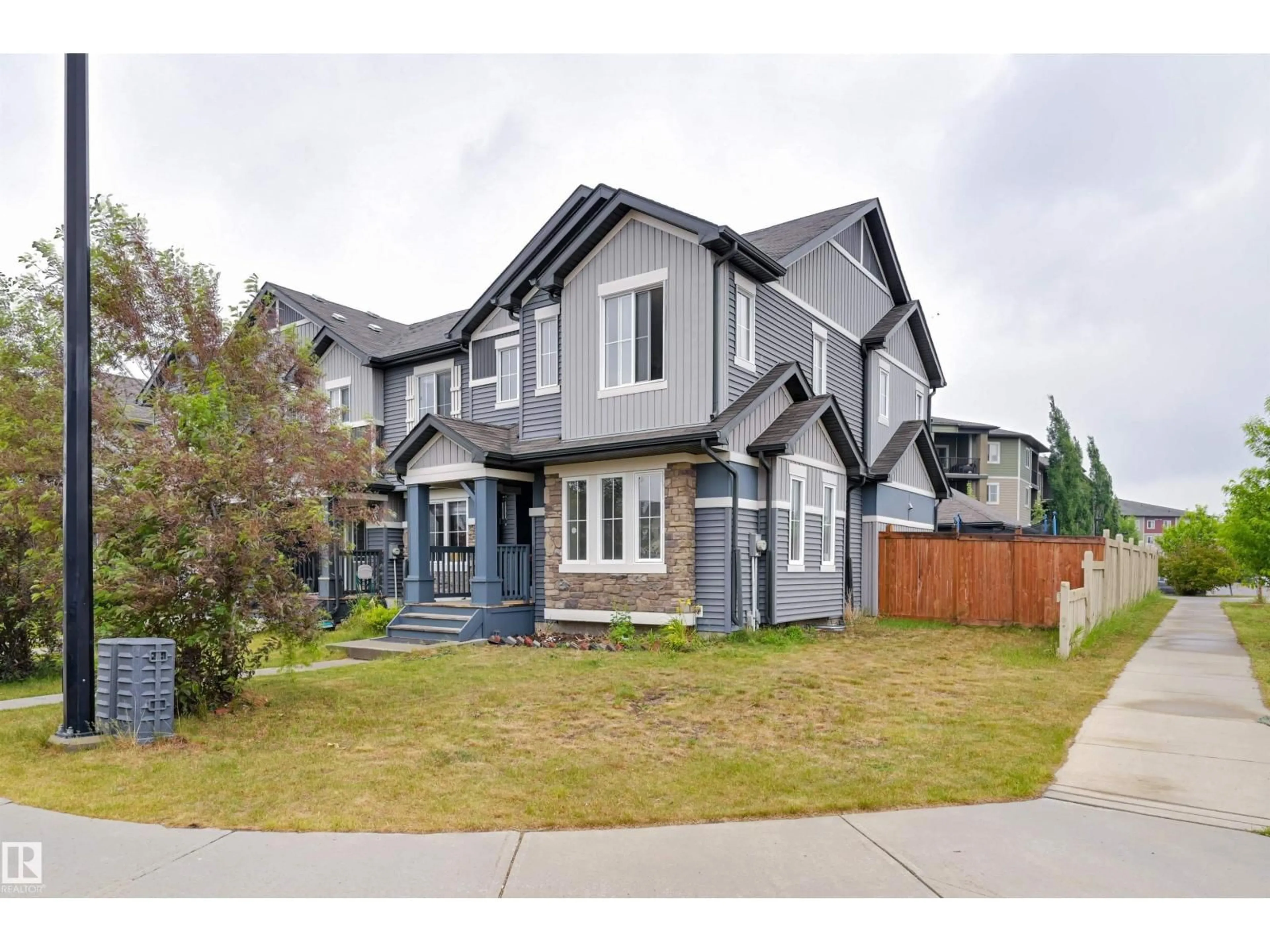 Home with vinyl exterior material, street for SW - 1807 52 ST, Edmonton Alberta T6X1Y1
