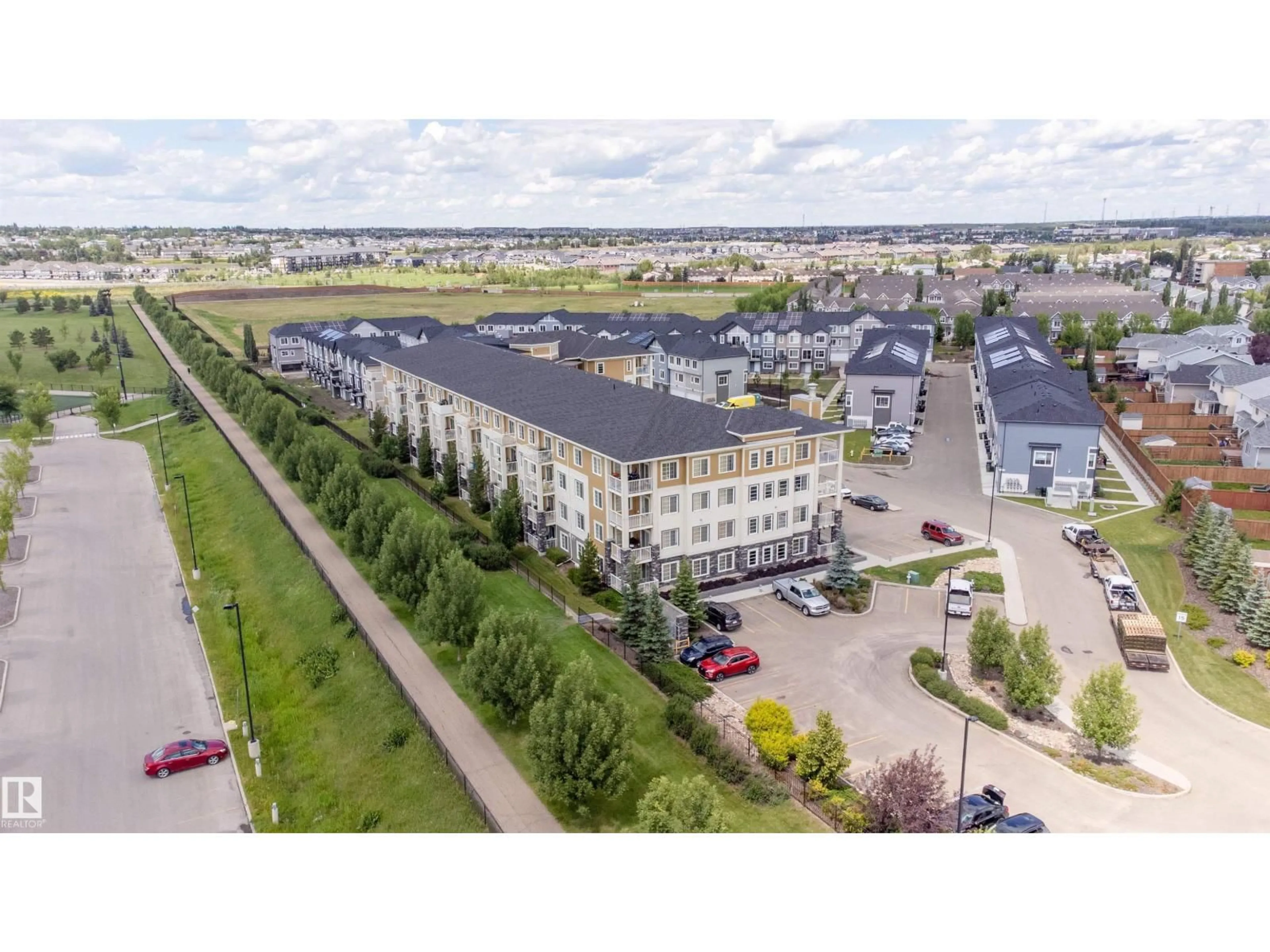 A pic from outside/outdoor area/front of a property/back of a property/a pic from drone, building for 207 - 3670 139 AV, Edmonton Alberta T5Y2N5