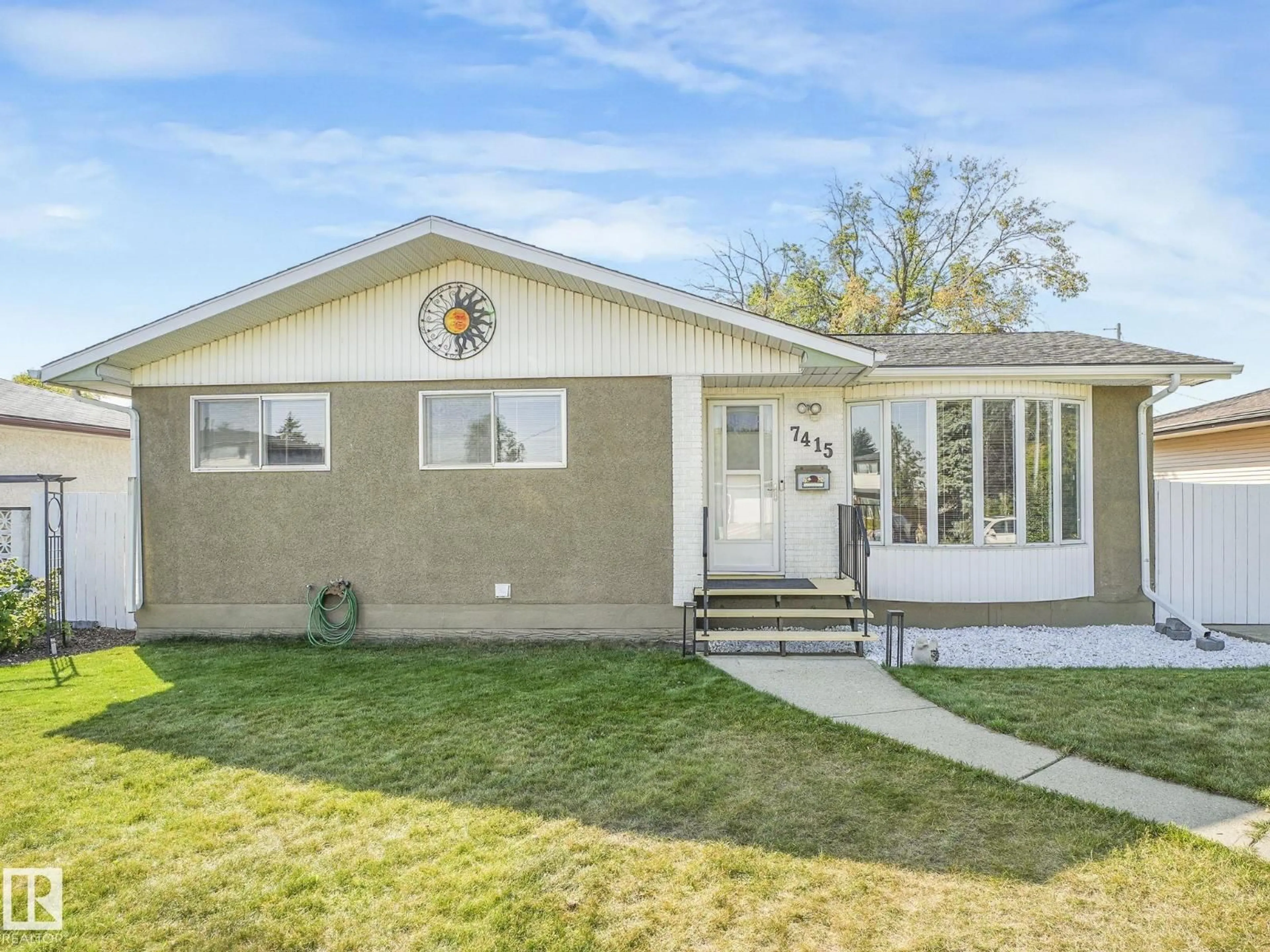 Home with vinyl exterior material, street for 7415 84 AV, Edmonton Alberta T6B0H9