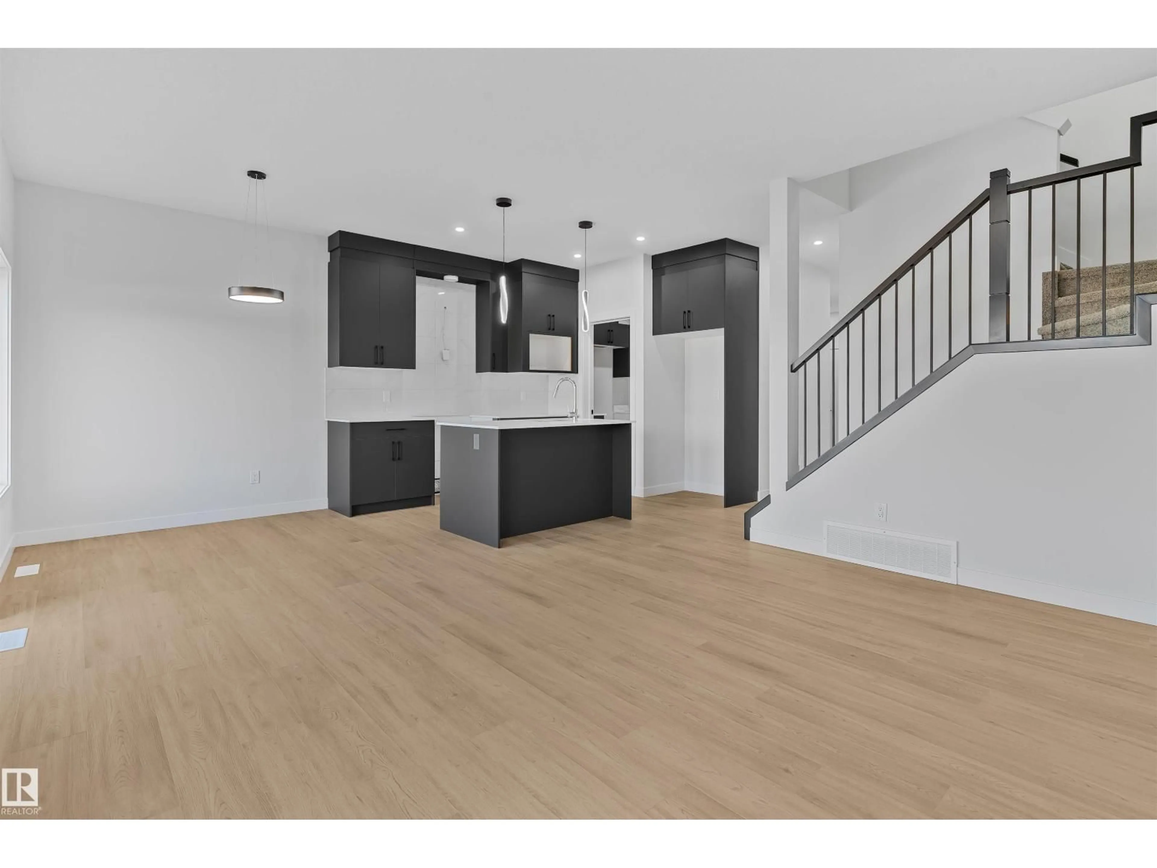 Open concept kitchen, wood/laminate floor for 215 24 ST, Edmonton Alberta T6X3K4
