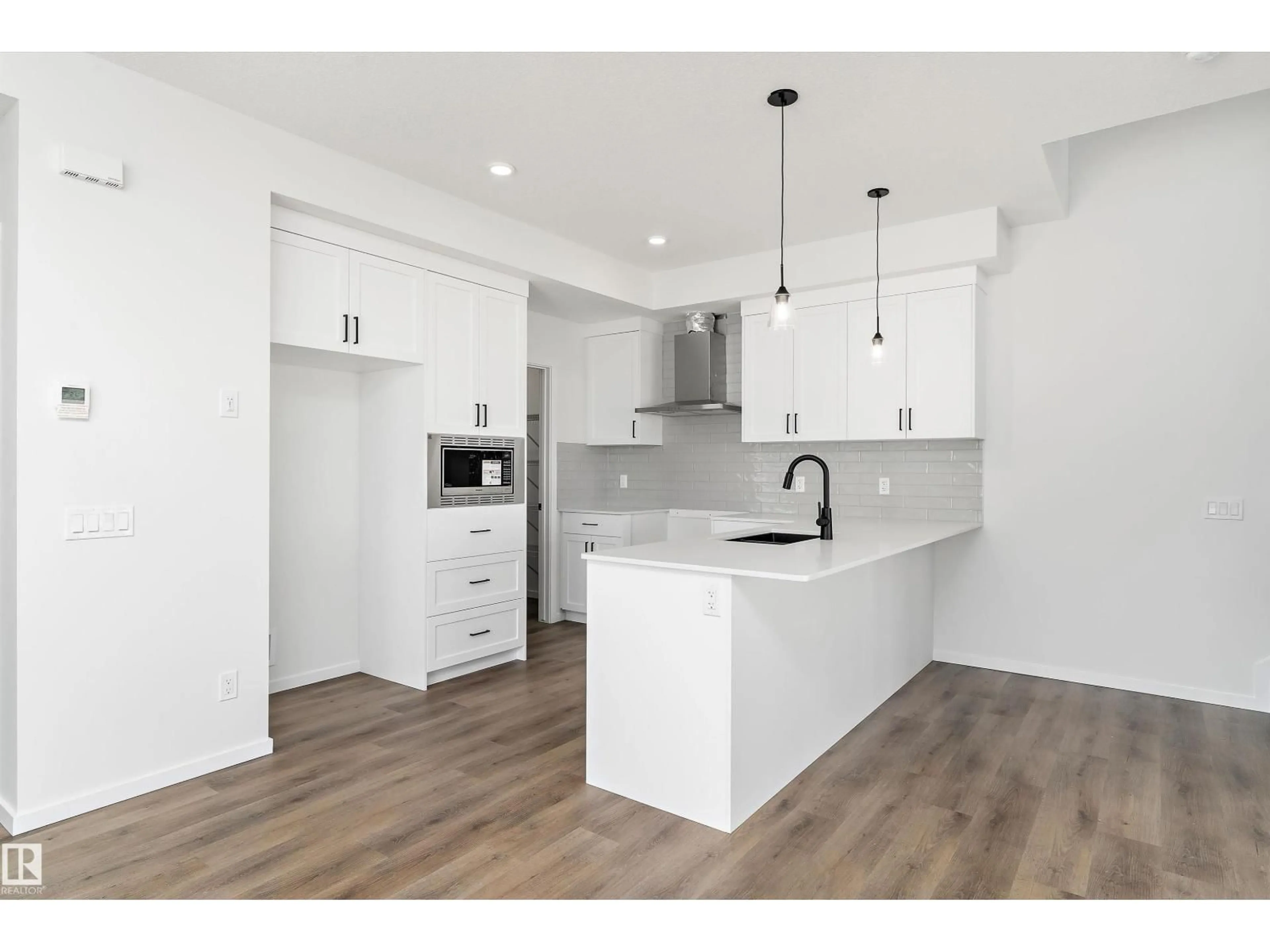 Open concept kitchen, wood/laminate floor for 1113 CRISTALL CRESCENT, Edmonton Alberta T6W2Z1