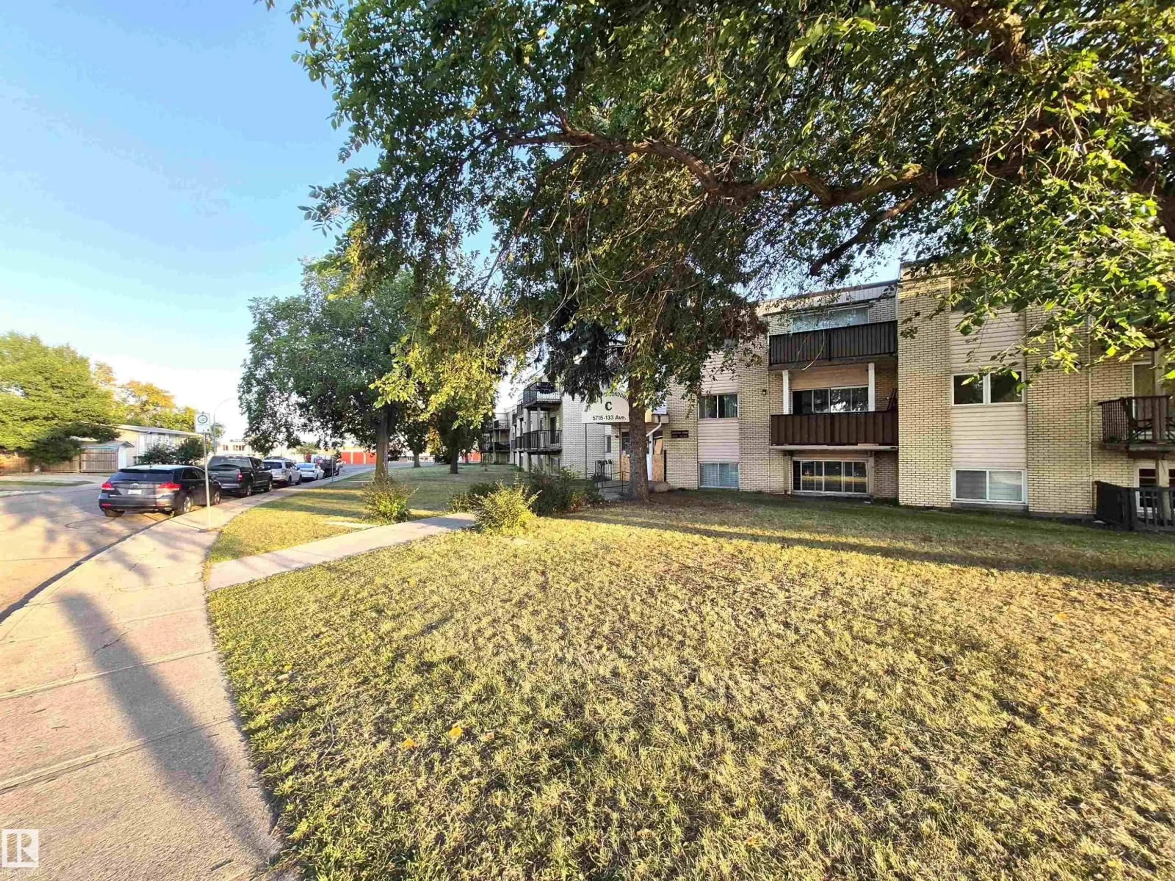 A pic from outside/outdoor area/front of a property/back of a property/a pic from drone, street for 22C - 5715 133 AV, Edmonton Alberta T5A0K3