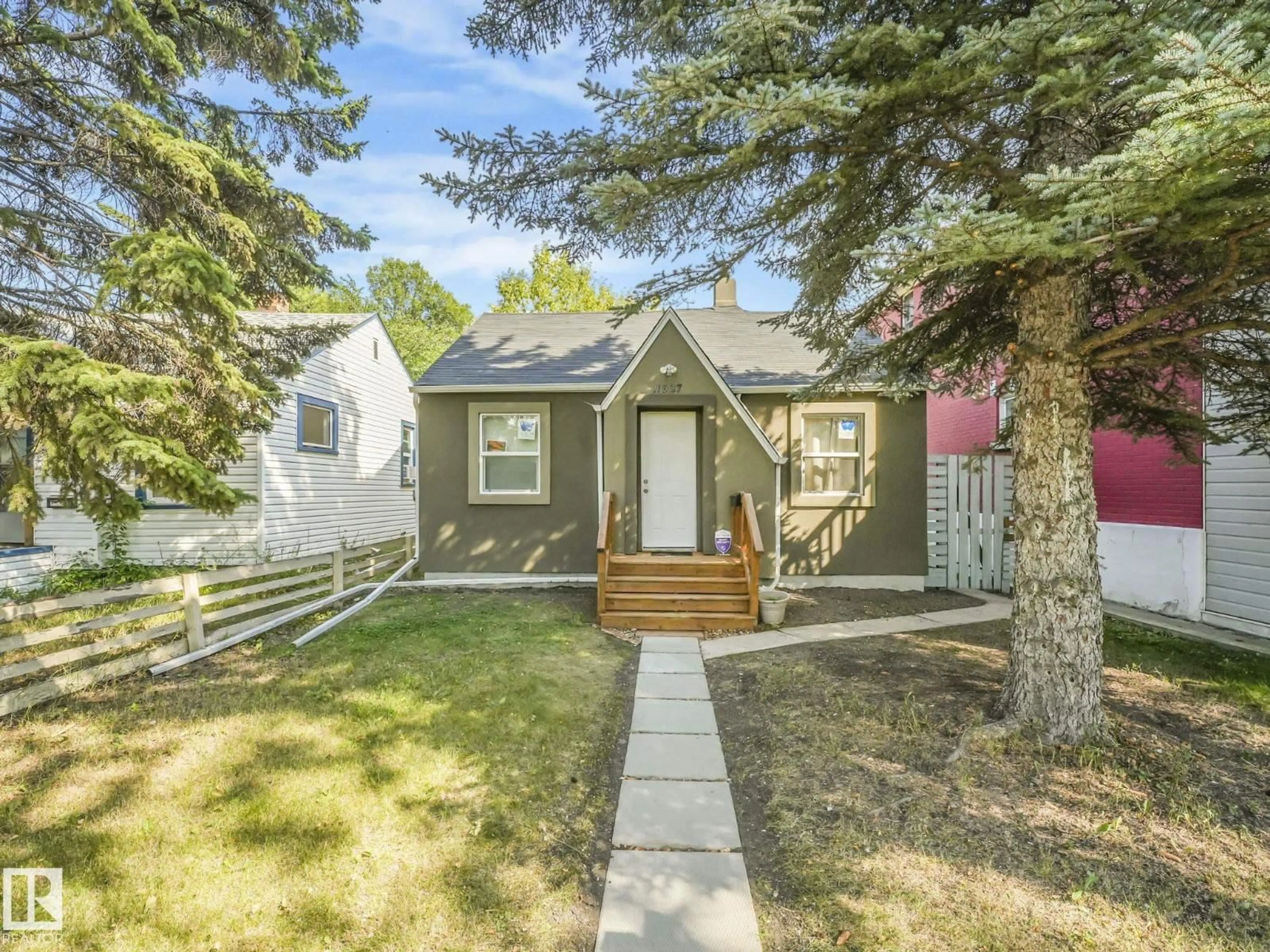 Home with vinyl exterior material, street for 11927 95A ST NW, Edmonton Alberta T5G1R4