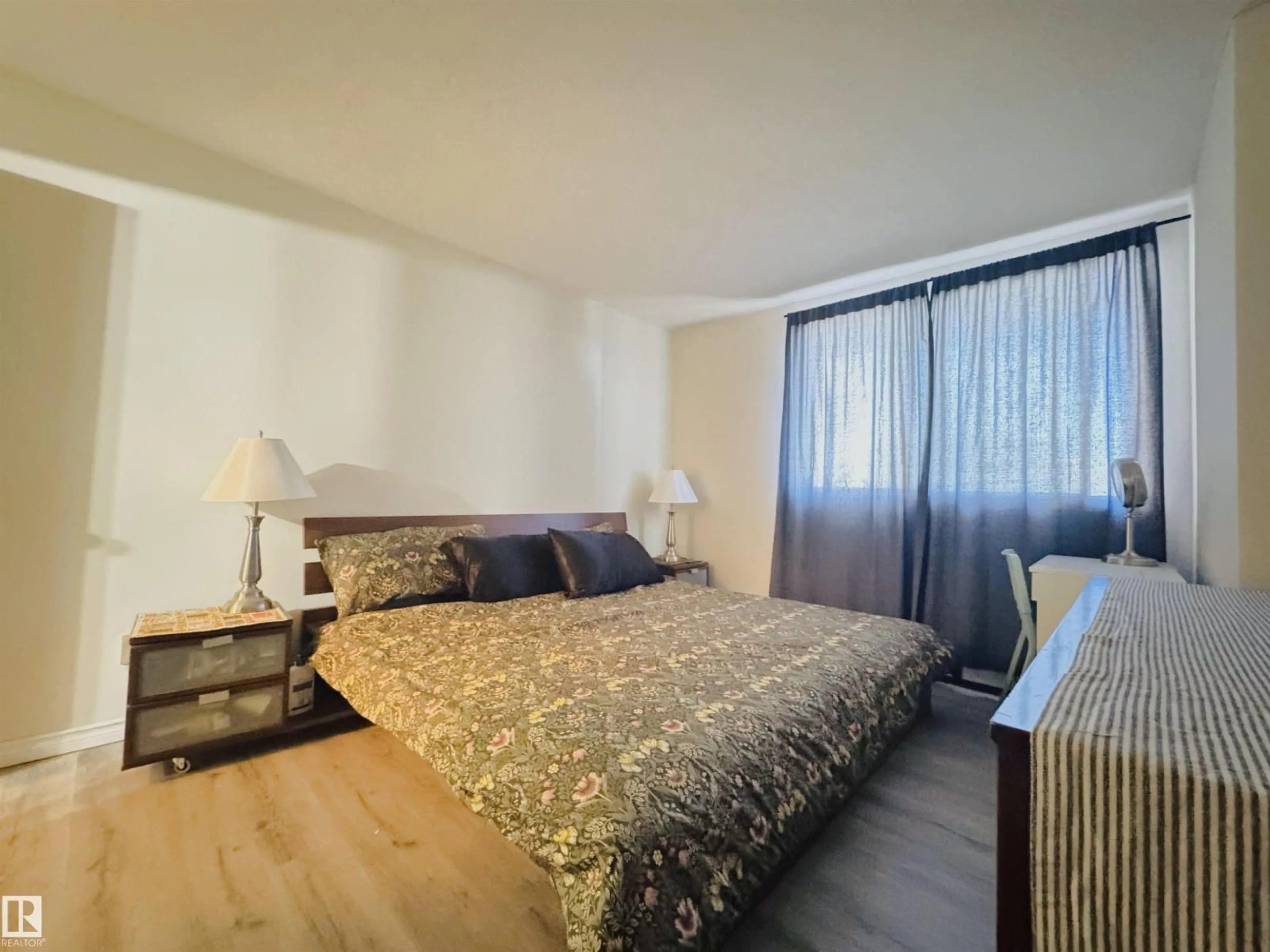 Bedroom with bed, wood/laminate floor for 207 - 9028 JASPER AV, Edmonton Alberta T5H3Y6