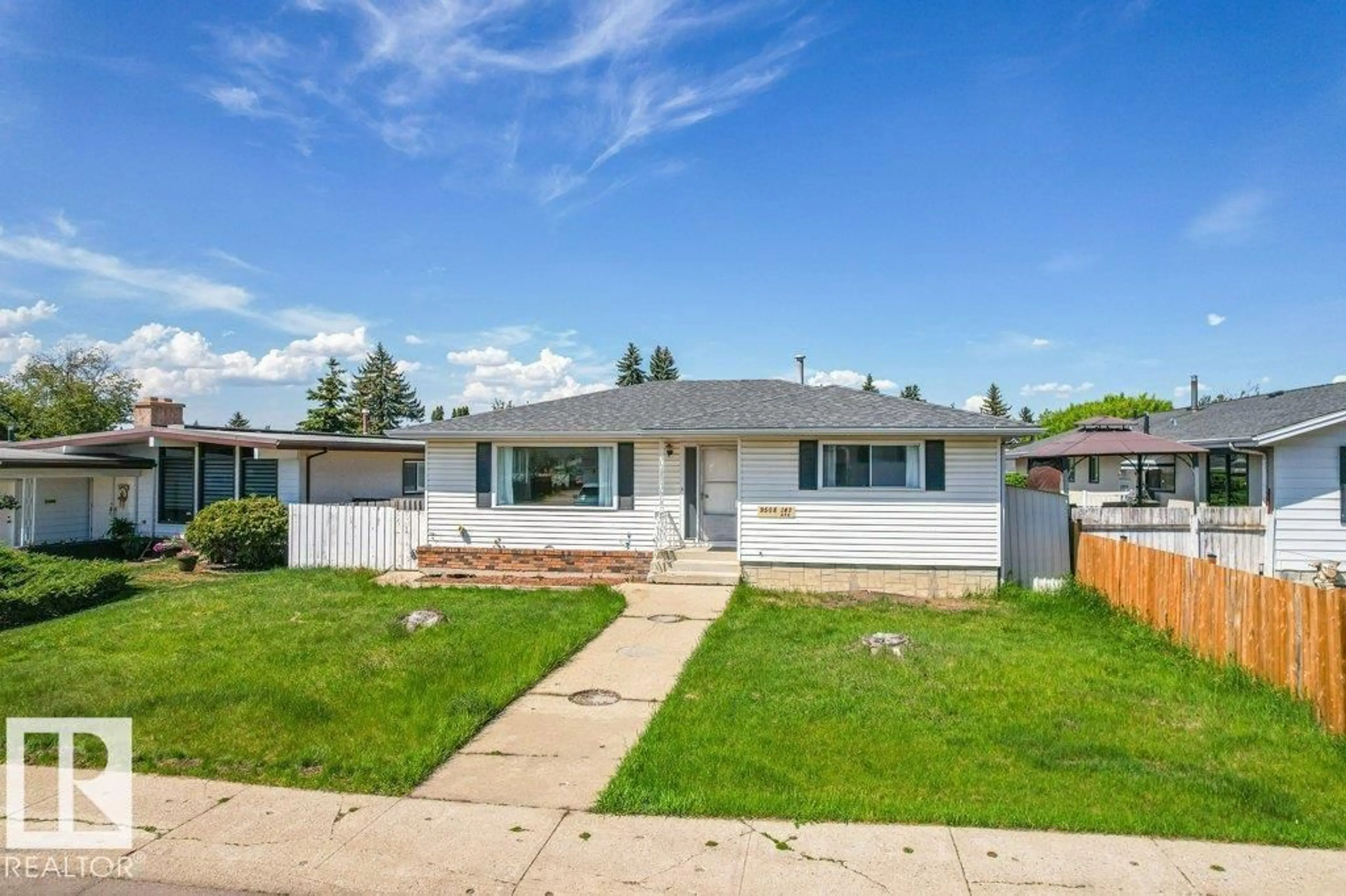 Home with vinyl exterior material, street for NW - 9508 147 AV, Edmonton Alberta T5E2K6
