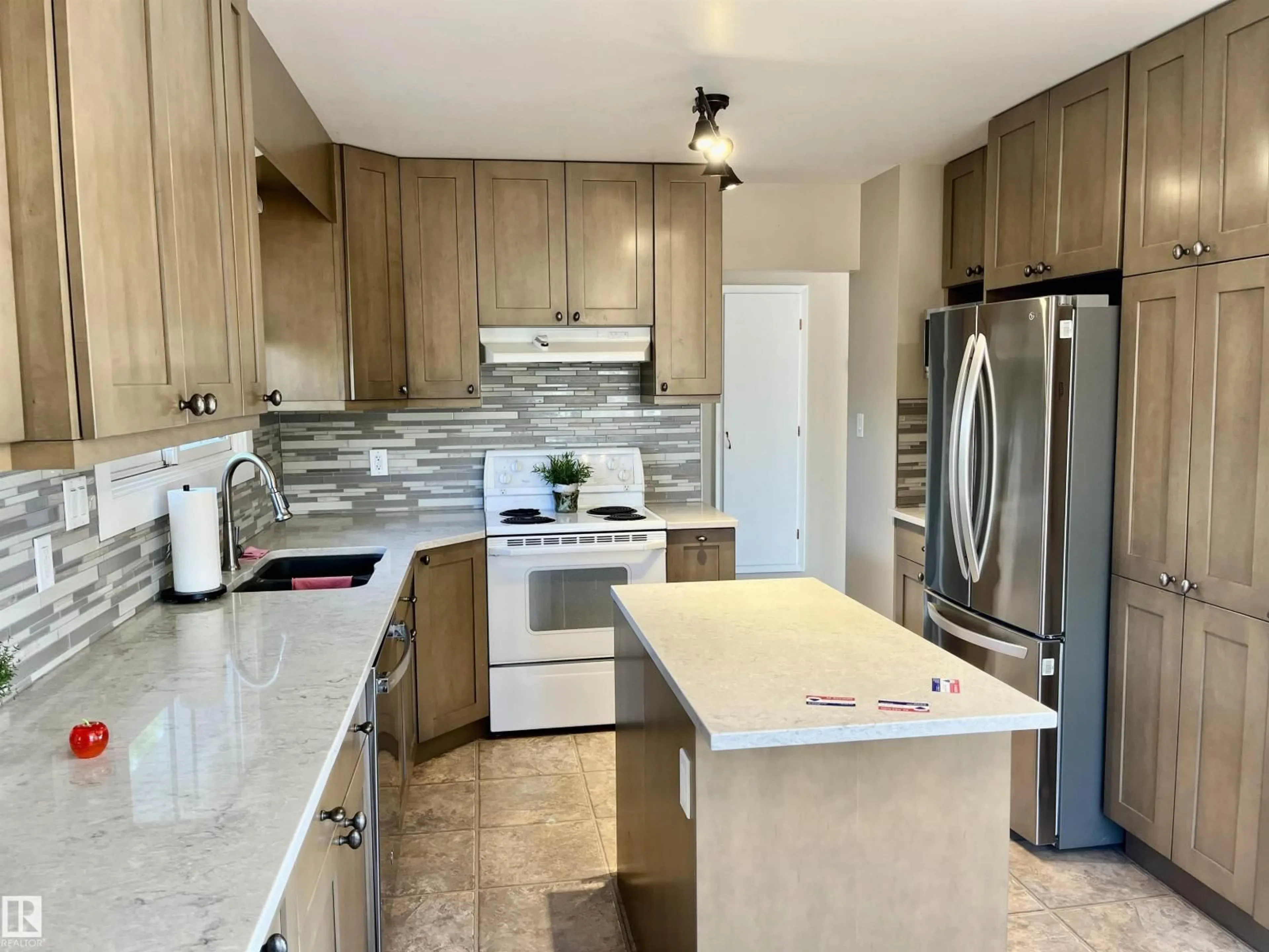 Open concept kitchen, ceramic/tile floor for 4337 48A ST, Vegreville Alberta T9C1B2