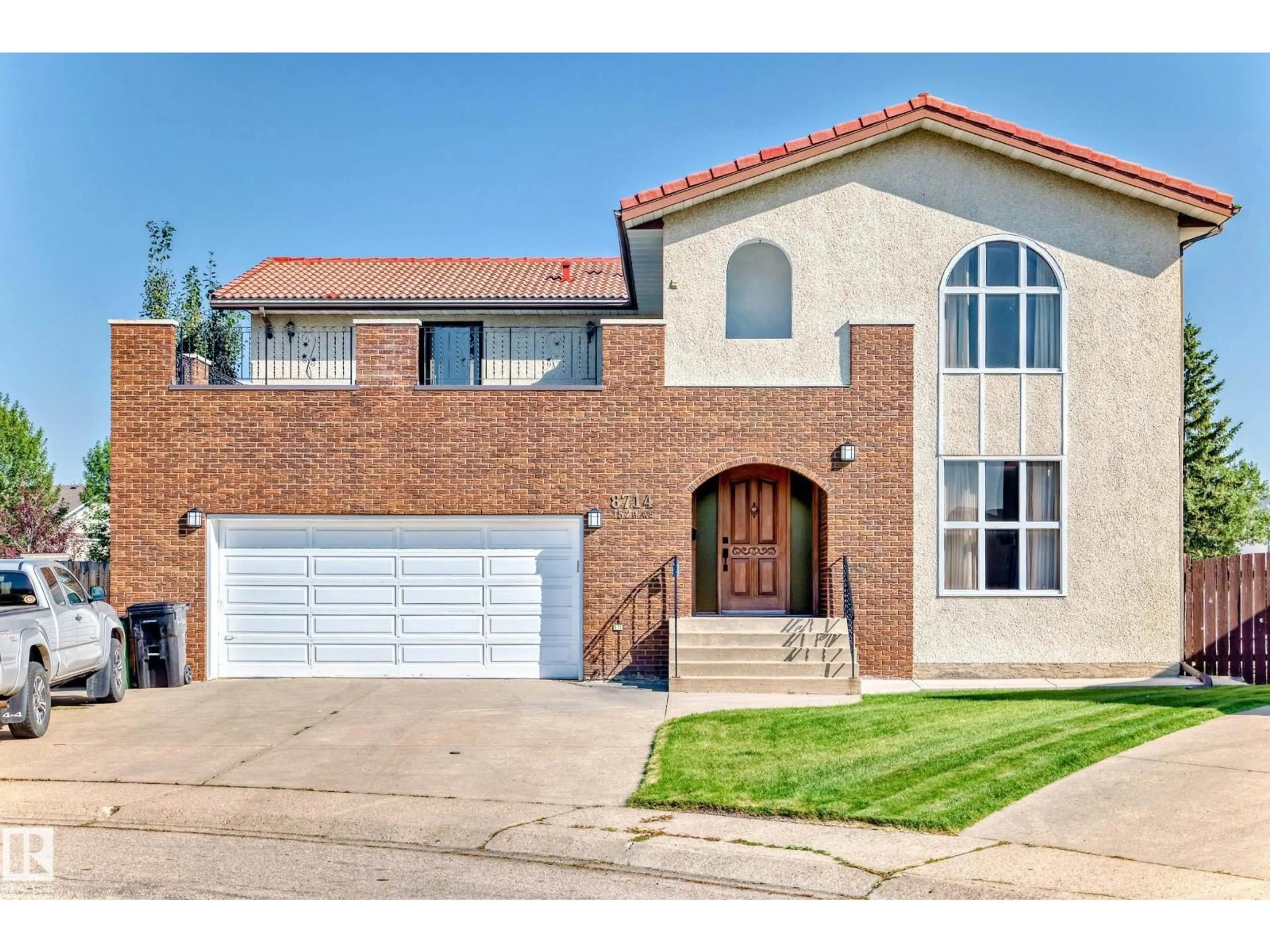 Home with brick exterior material, street for NW - 8714 152B AV, Edmonton Alberta T5E6H2