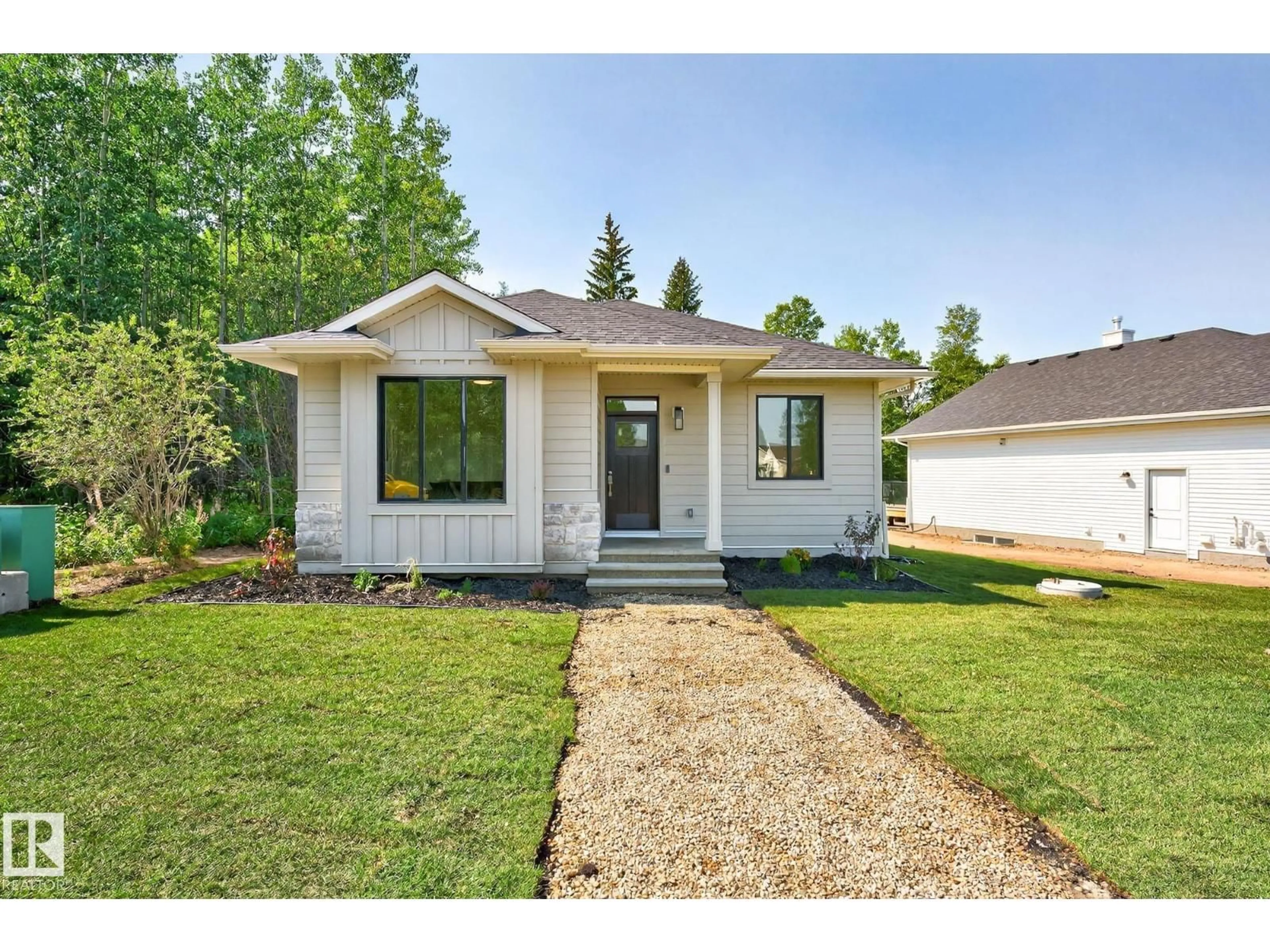 Home with vinyl exterior material, street for 112 HERON POINT CL, Rural Wetaskiwin County Alberta T0C2V0