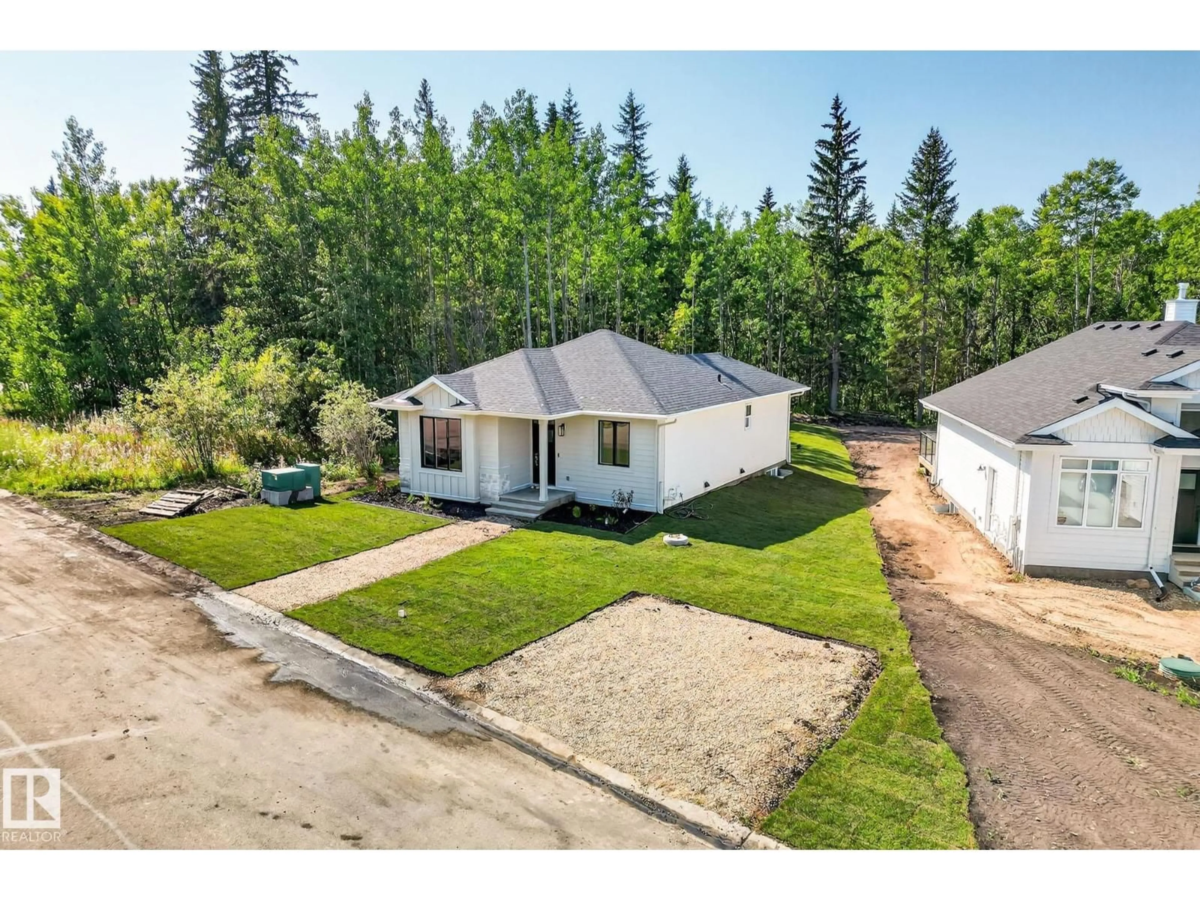 A pic from outside/outdoor area/front of a property/back of a property/a pic from drone, street for 112 HERON POINT CL, Rural Wetaskiwin County Alberta T0C2V0