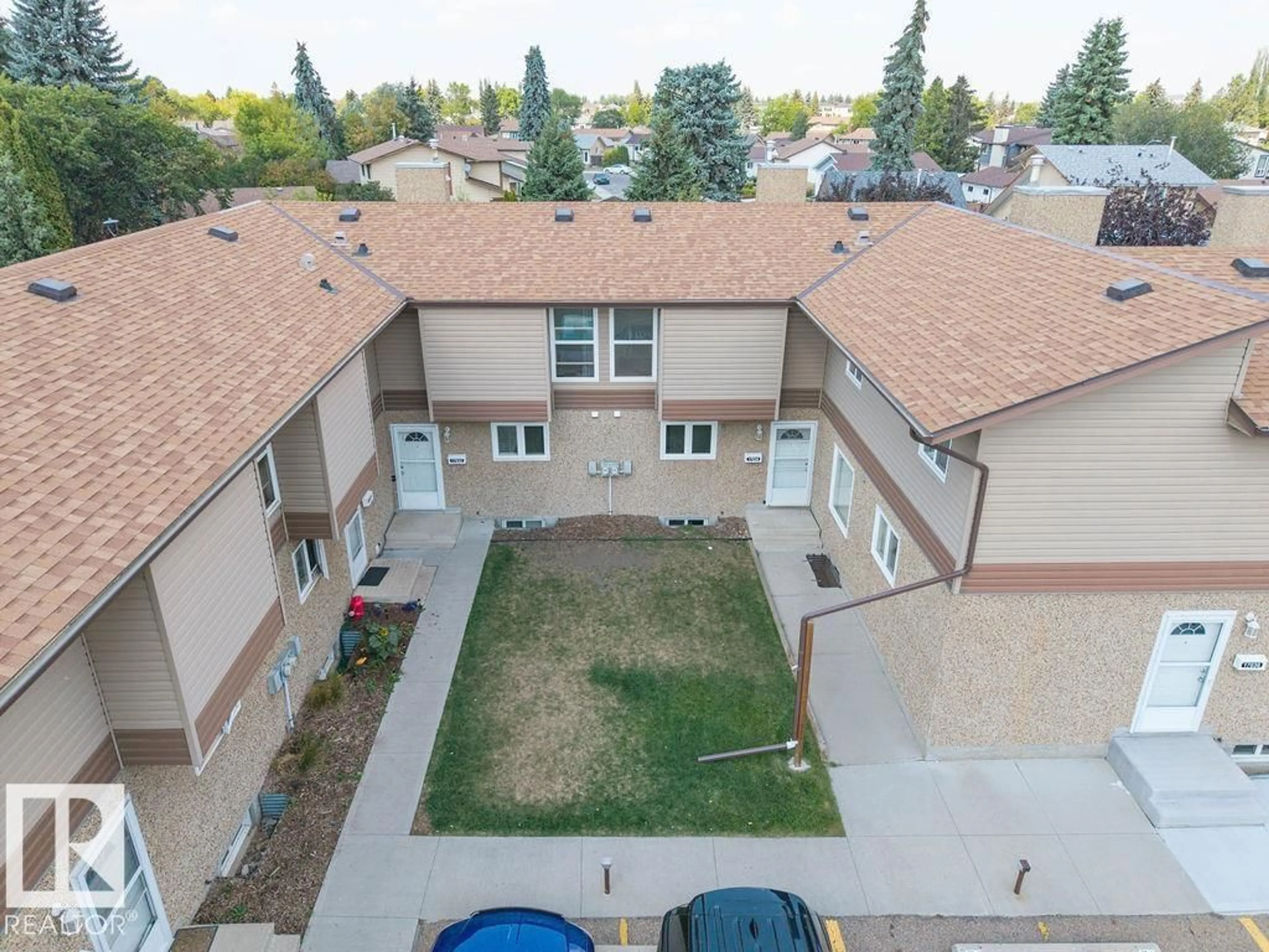 A pic from outside/outdoor area/front of a property/back of a property/a pic from drone, unknown for NW - 17034 100 ST, Edmonton Alberta T5J0N3