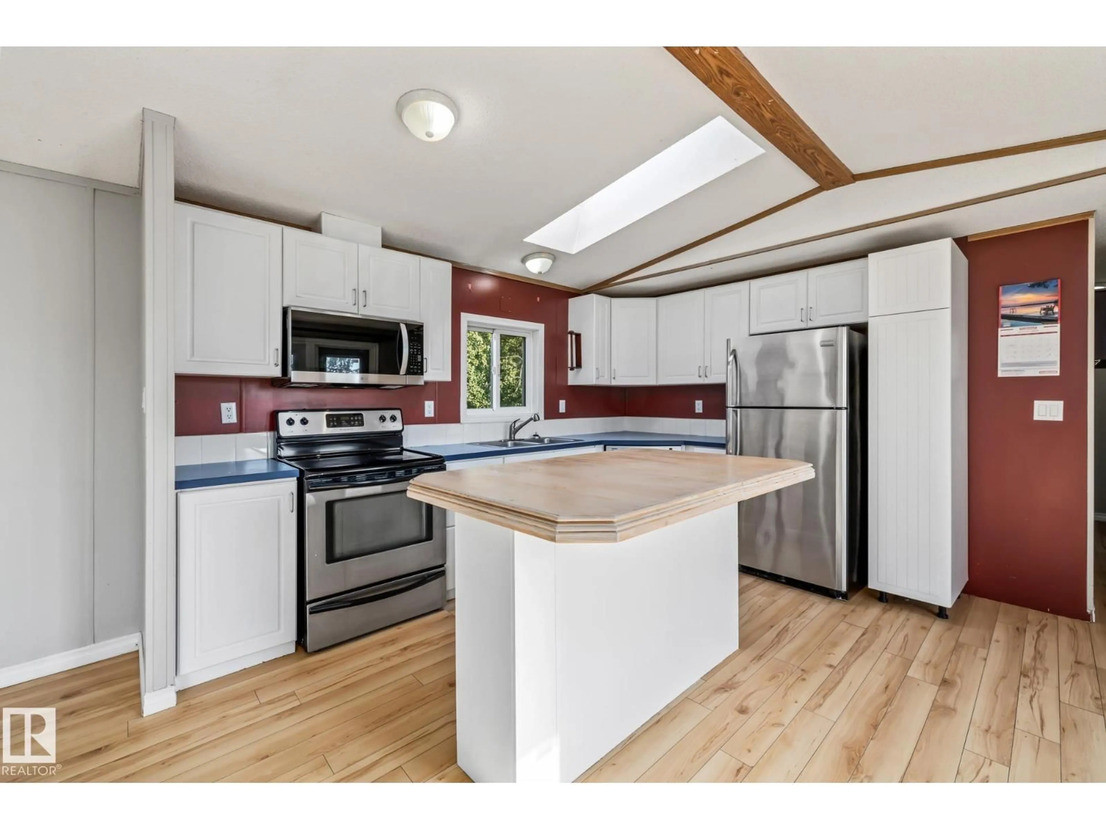 Open concept kitchen, wood/laminate floor for 56430 RGE ROAD 263, Rural Sturgeon County Alberta T8R0X9