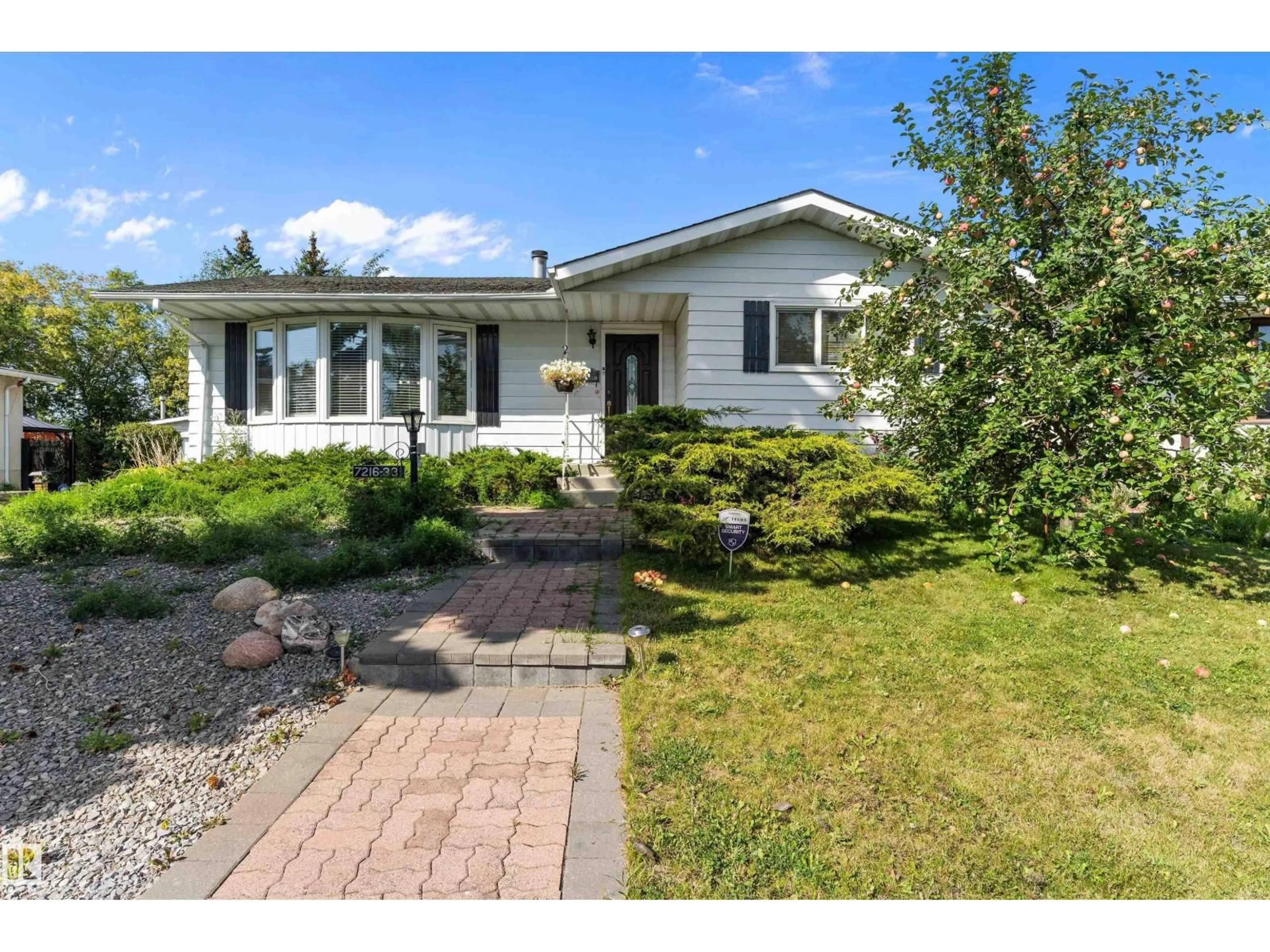 Home with vinyl exterior material, street for 7216 33 AV NW, Edmonton Alberta T6K1K3