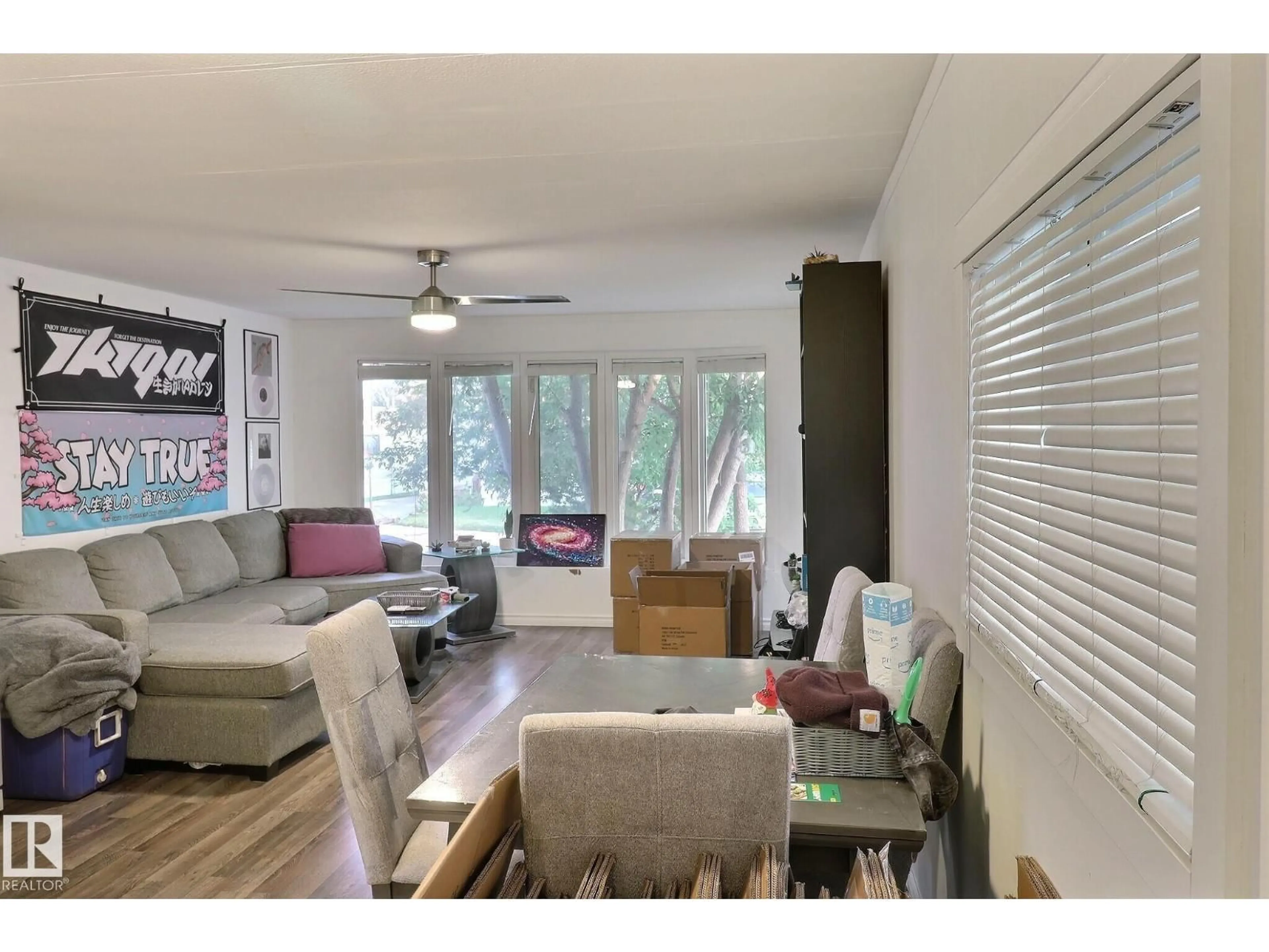 Living room with furniture, wood/laminate floor for 508 EVERGREEN PA, Edmonton Alberta T5Y4M2