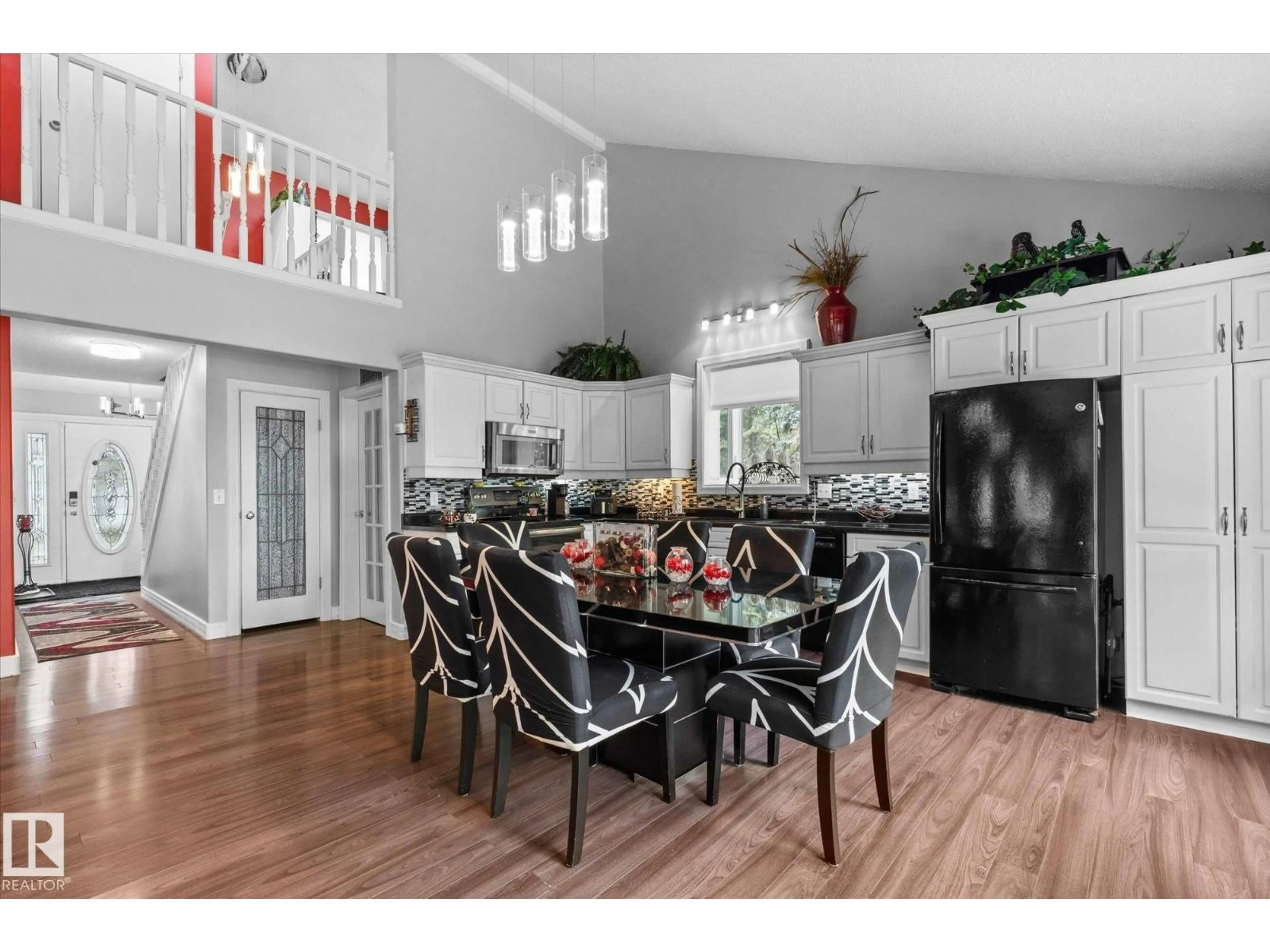 Open concept kitchen, wood/laminate floor for 96 4418 HWY 633, Rural Lac Ste. Anne County Alberta T0E0L0