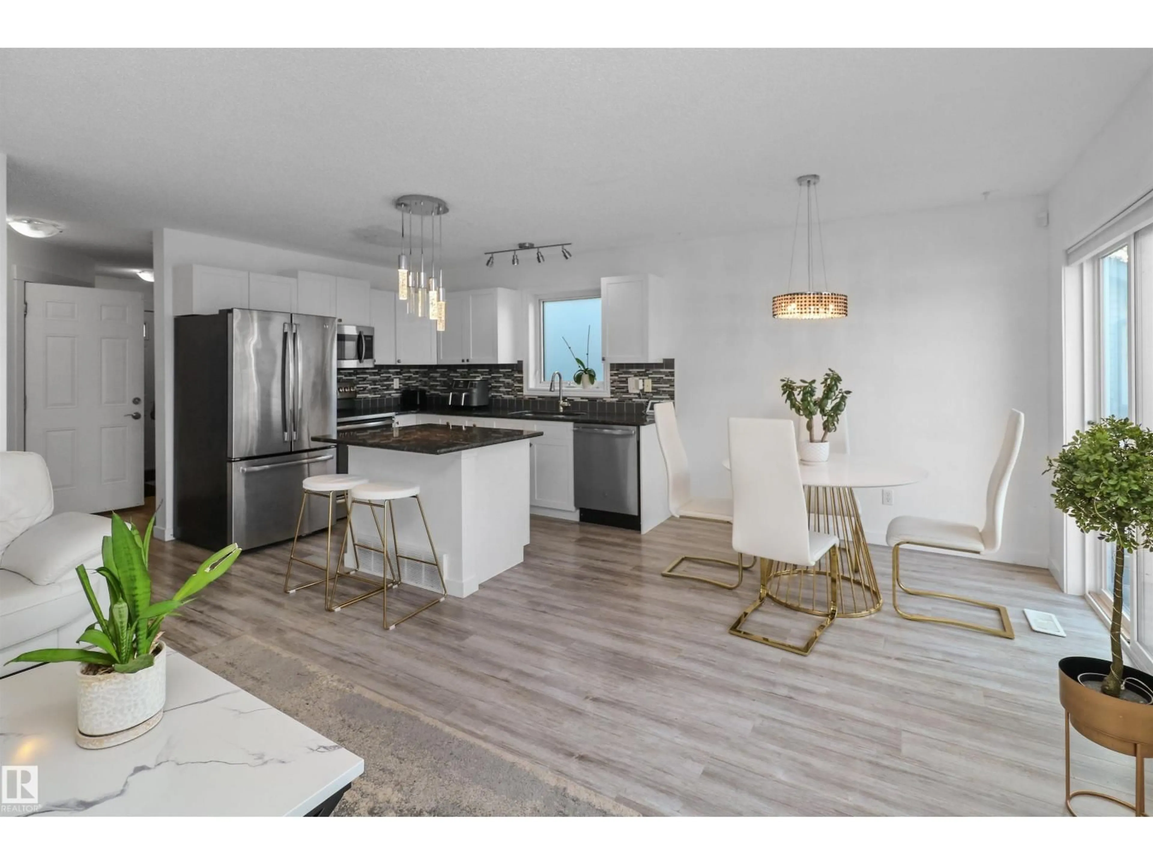 Open concept kitchen, wood/laminate floor for SW - 6426 1A AV, Edmonton Alberta T6X0B5