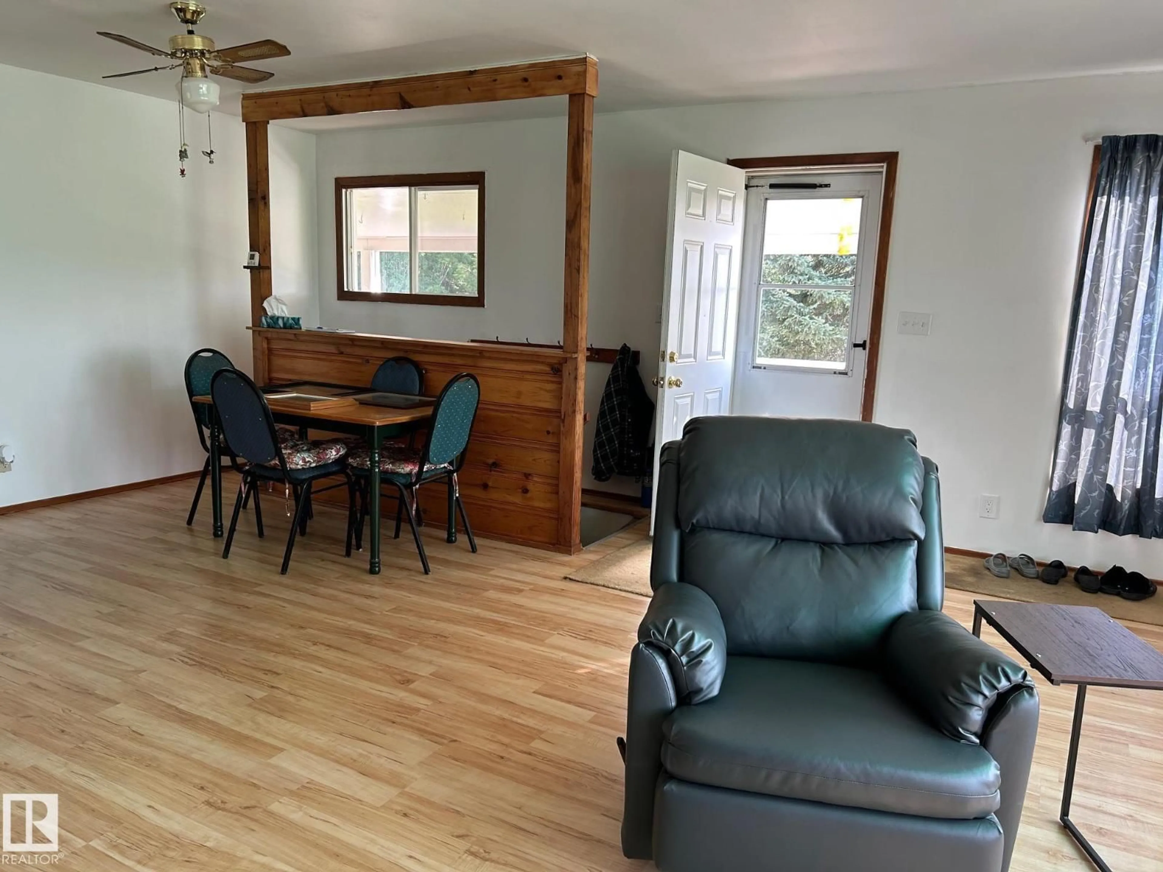 Living room with furniture, wood/laminate floor for 60432 RGE RD 222, Rural Thorhild County Alberta T0A3J0