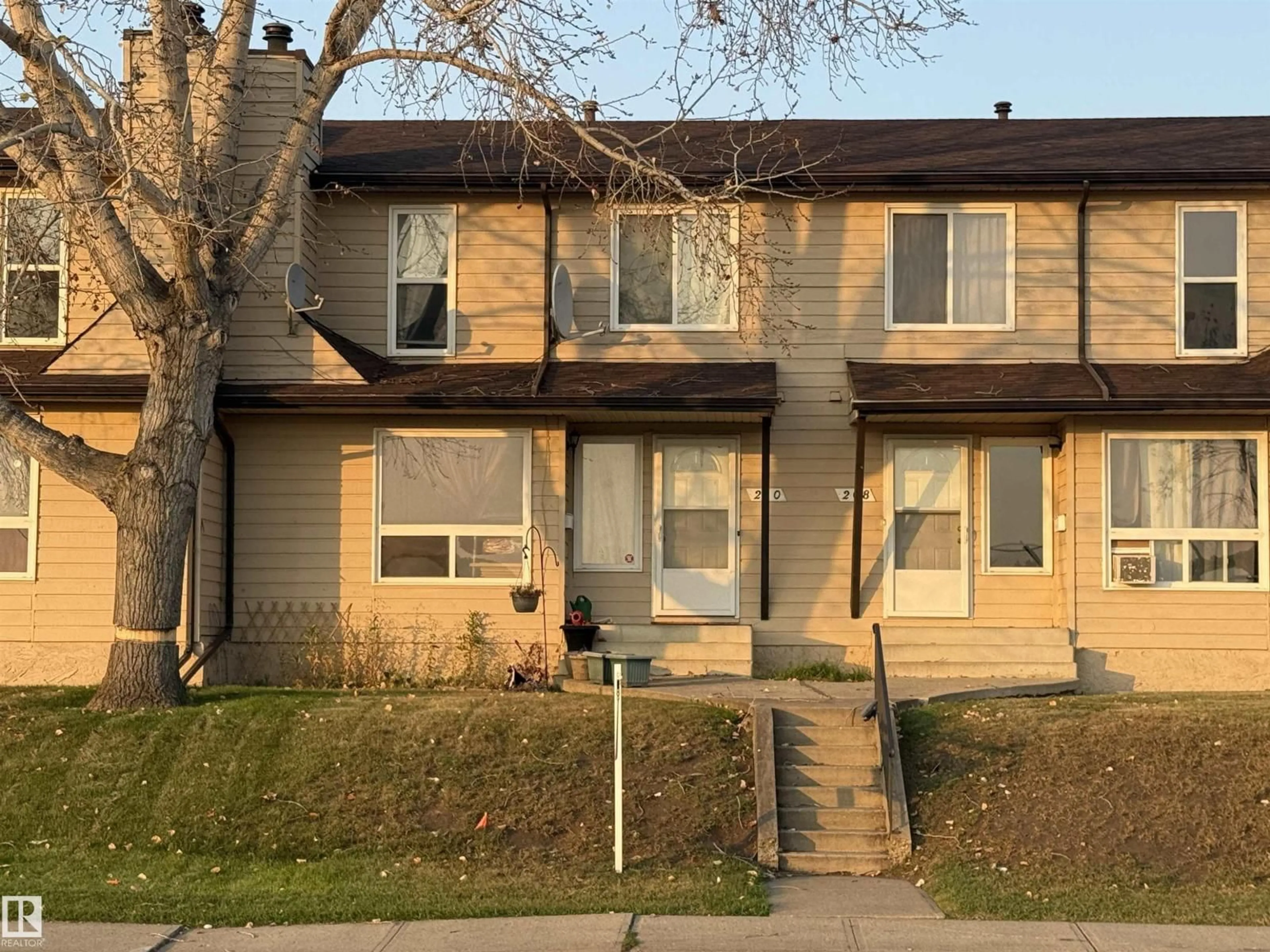 Home with vinyl exterior material, street for 210 WARWICK RD, Edmonton Alberta T5X4P8