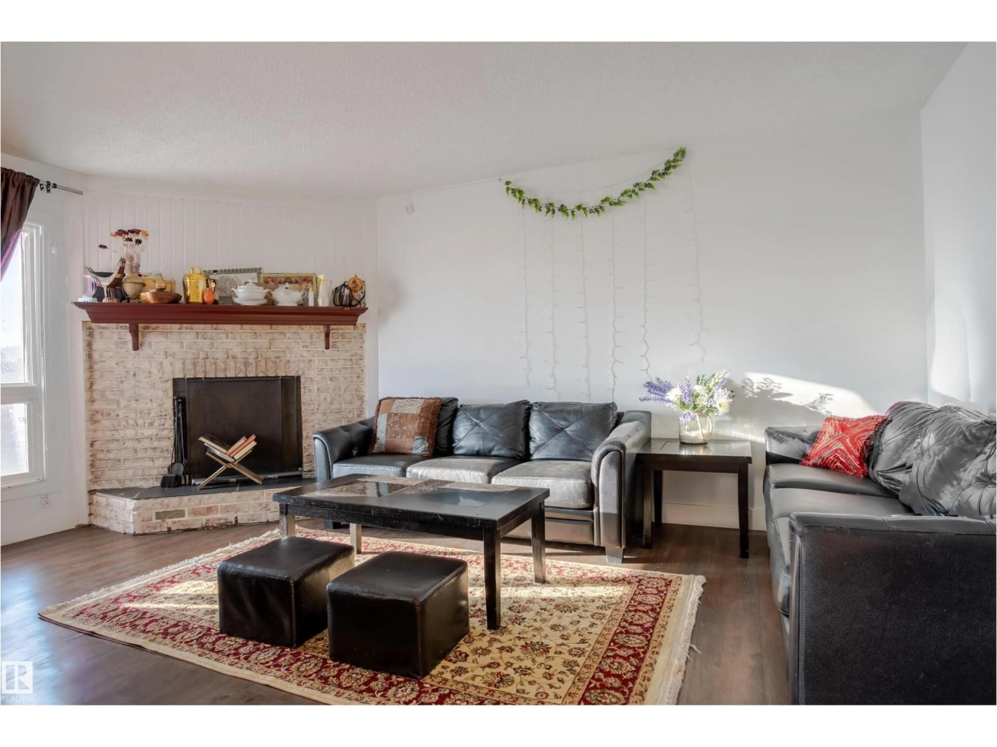 Living room with furniture, wood/laminate floor for 210 WARWICK RD, Edmonton Alberta T5X4P8