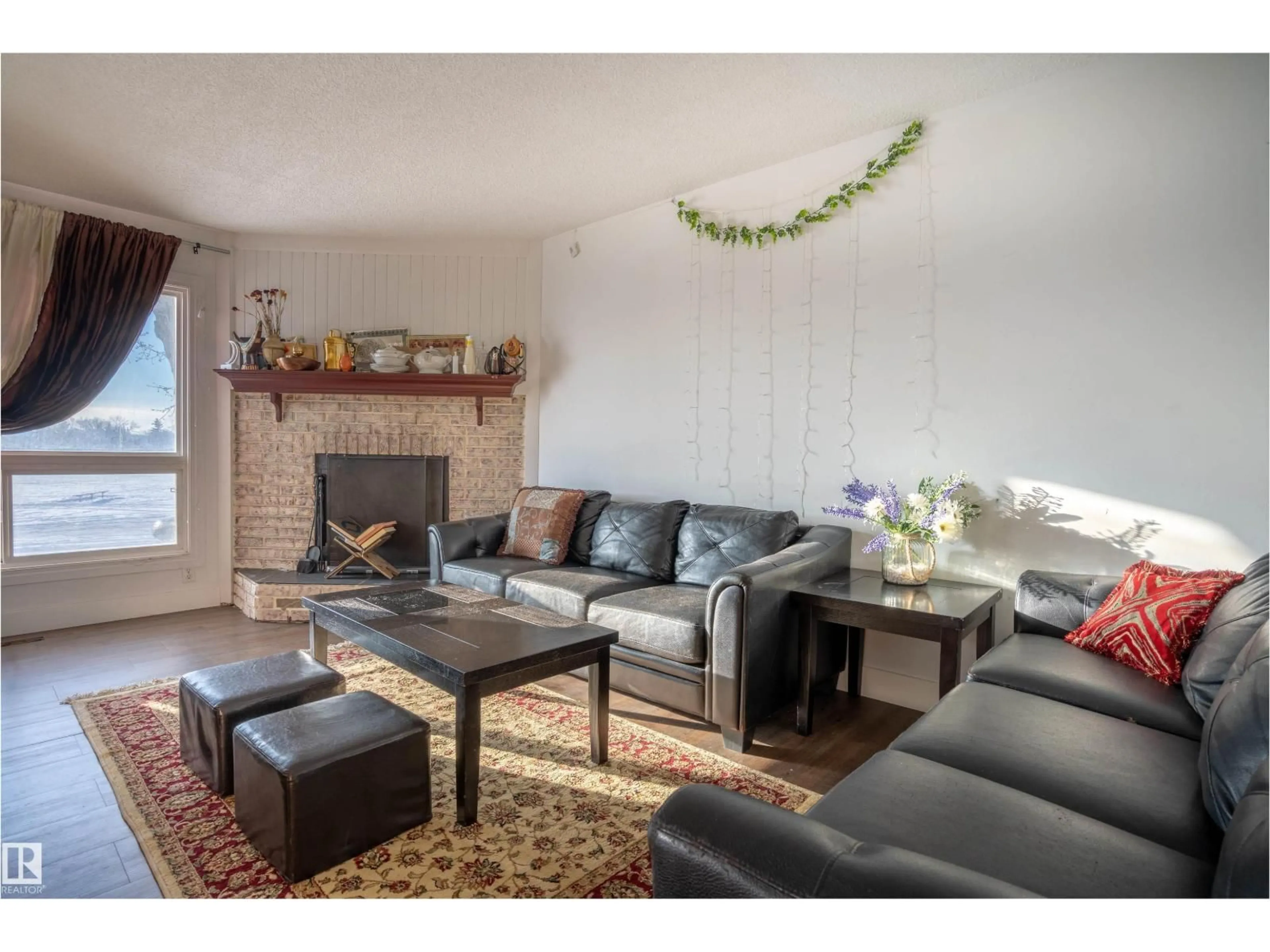 Living room with furniture, wood/laminate floor for 210 WARWICK RD, Edmonton Alberta T5X4P8