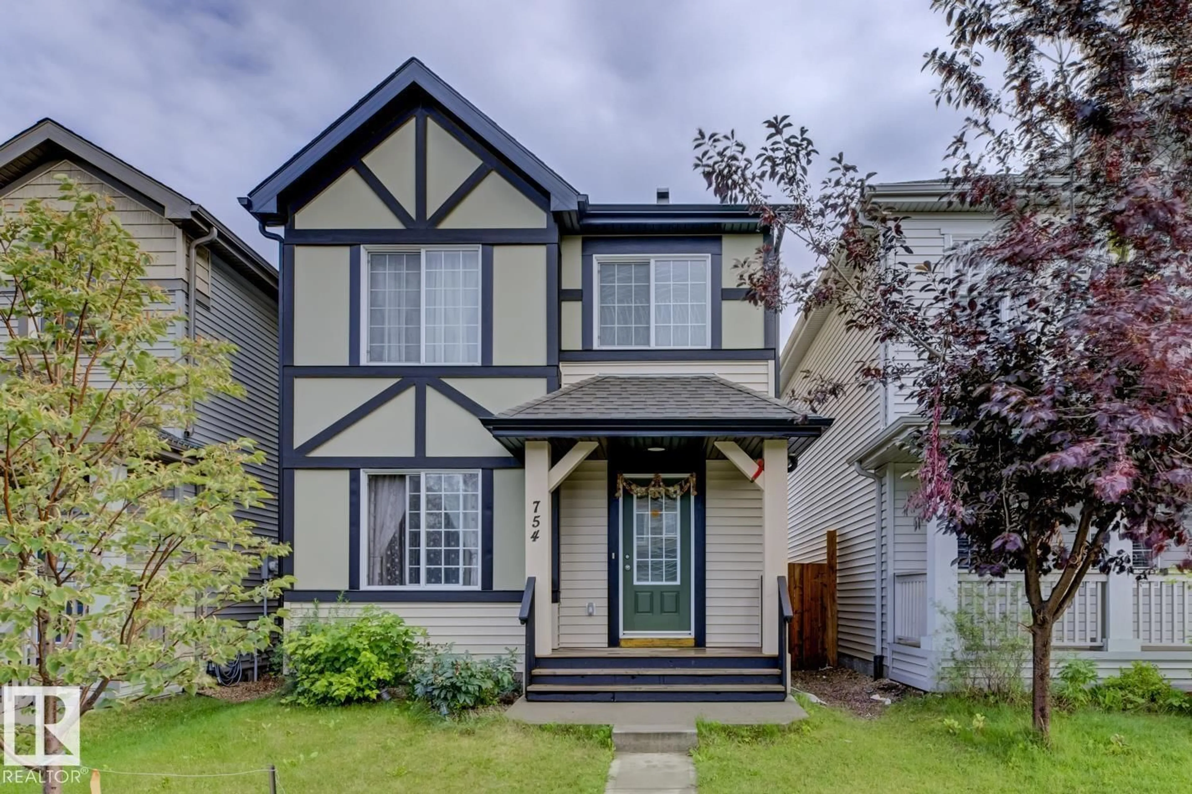 Home with vinyl exterior material, street for 754 EAGLESON CR, Edmonton Alberta T6M0V2