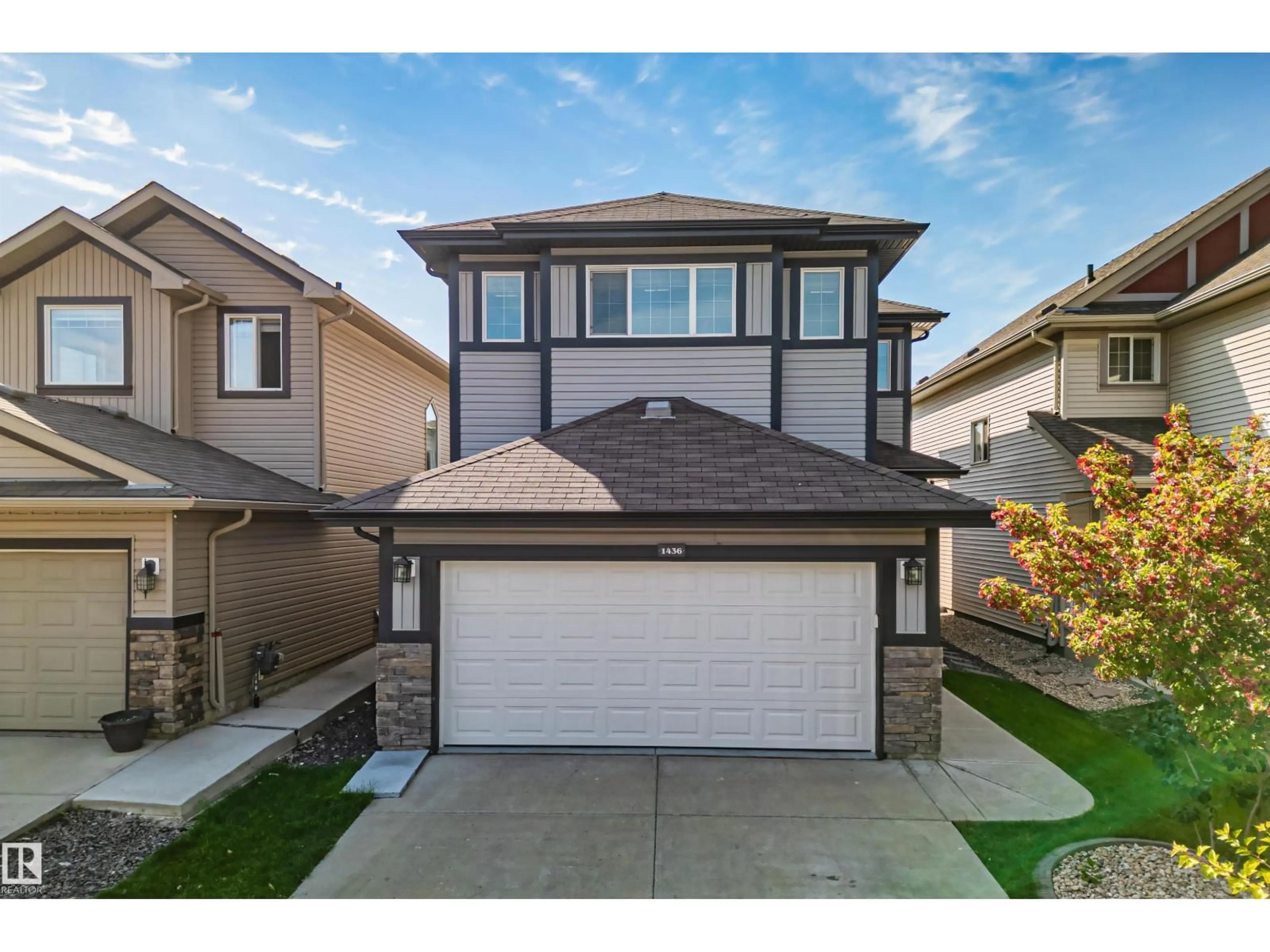Home with vinyl exterior material, street for 1436 29 STREET, Edmonton Alberta T6T1A8