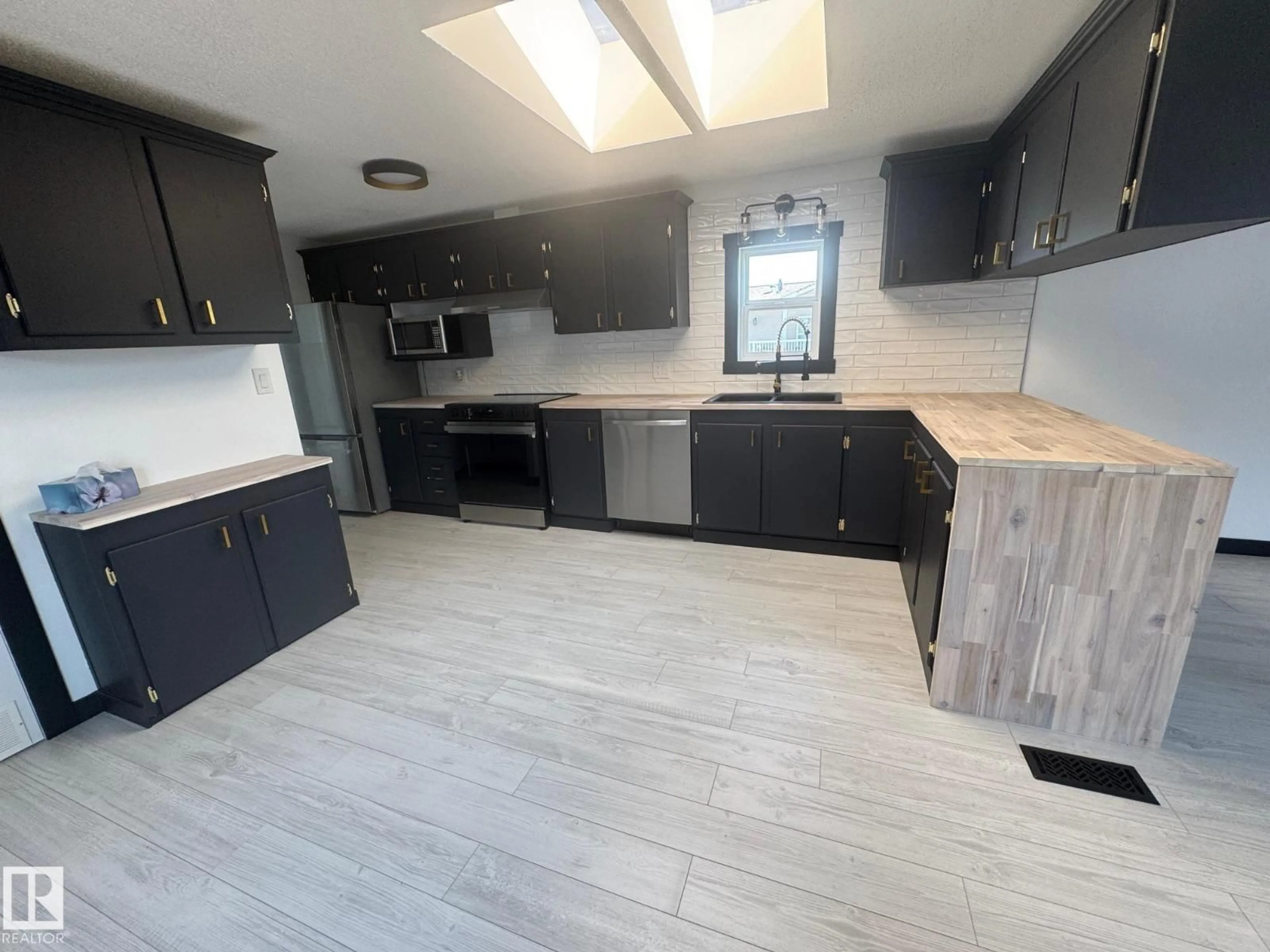 Open concept kitchen, ceramic/tile floor for 835 53222 RGE RD 272, Rural Parkland County Alberta T7X3R2